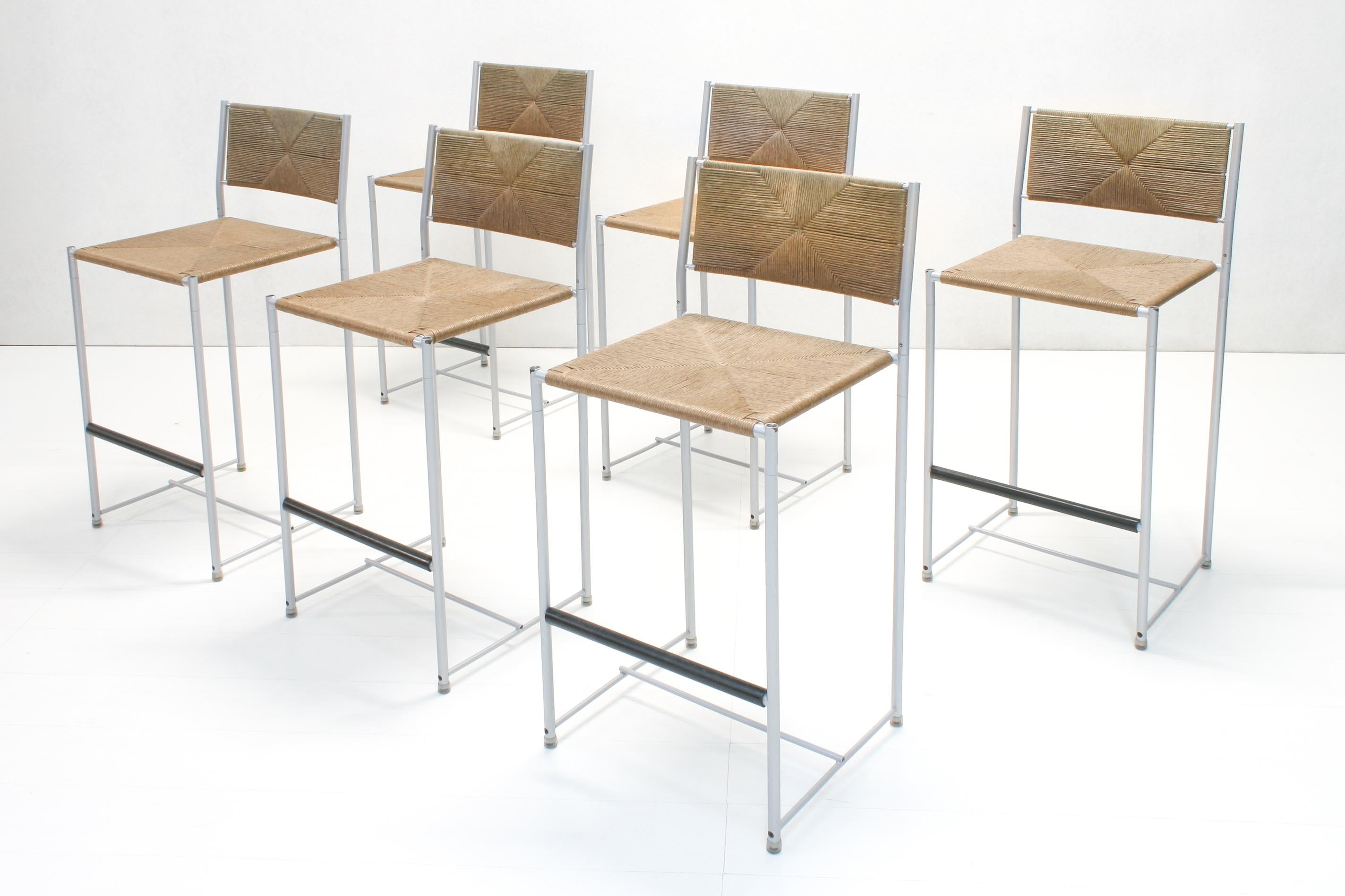 A set of six rush seat and steel tube Paludis bar stools designed by Giandomenico Belotti for Alias, Italy.
Seating height is 64 cm.