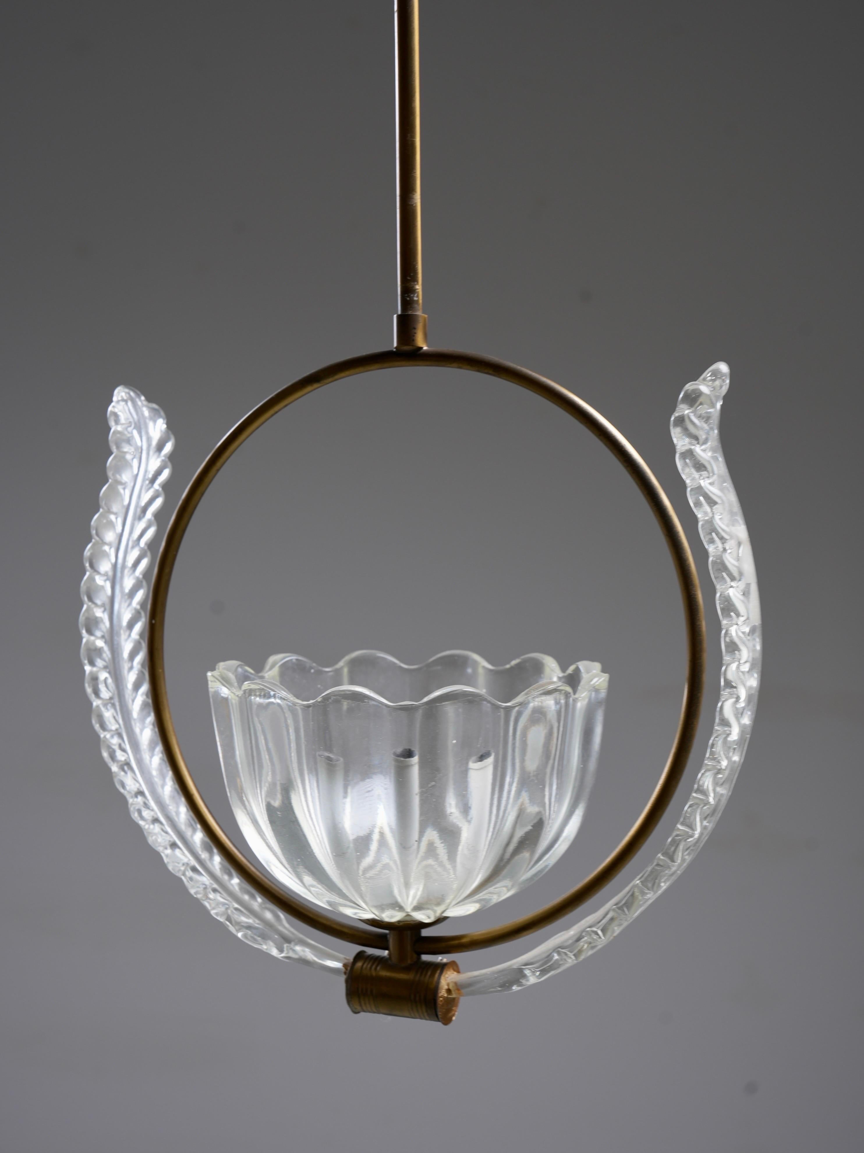 Set of Six Italian Glass and Brass Pendant Lights

A charming set of six Italian glass and brass pendant lights, perfect for creating a cohesive and elegant atmosphere. These vintage fixtures feature unique glass designs paired with timeless brass