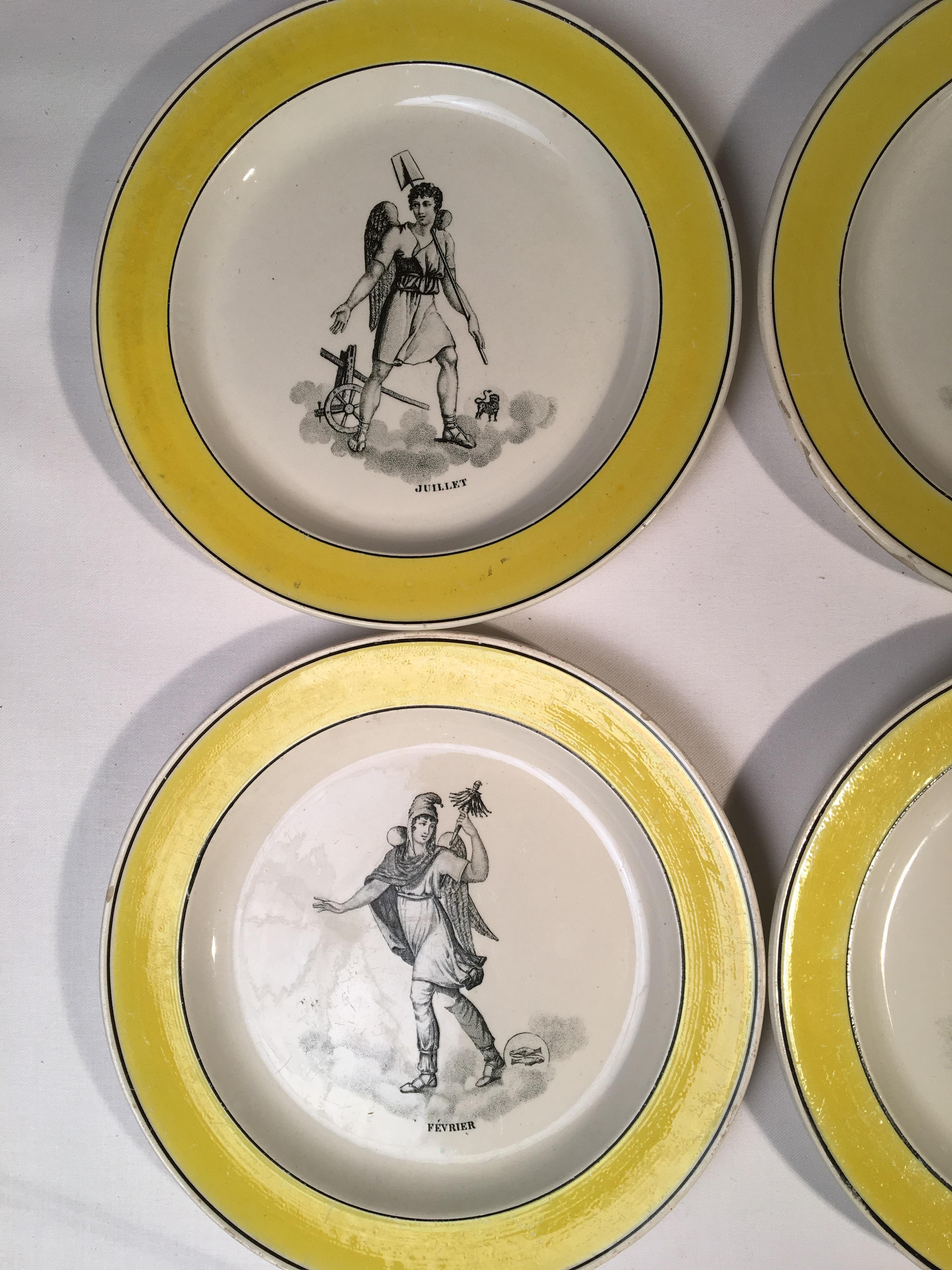 A partial set of 6 yellow and black glazed pictorial plates showing the months of the year, French, Creil et Montereau, early 19th century.