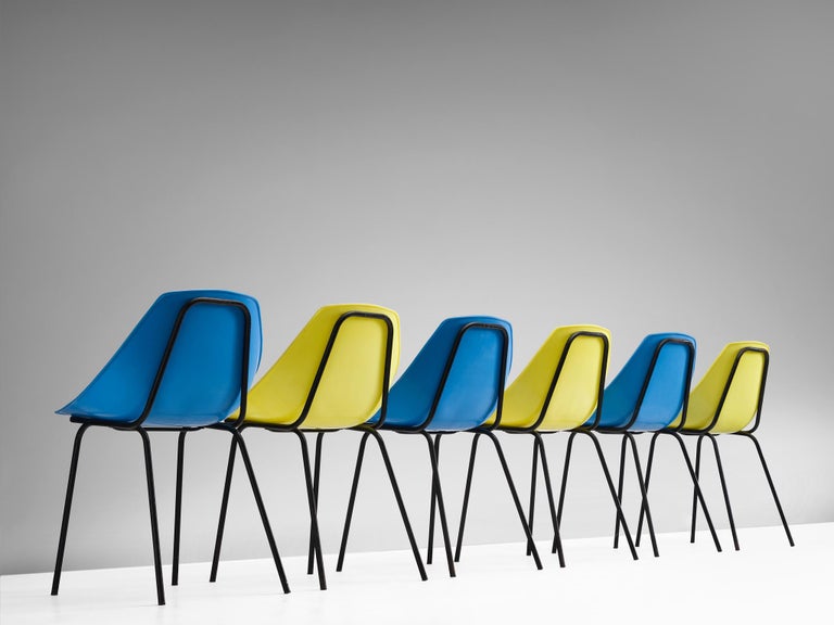 Pierre Guariche for Meurop, set of six chairs in yellow and blue plastic, model 'Coquillage', Belgium, 1960s.

The playful lines of the seat shell work well with the Industrial character of the black tubular frame. The design is simple yet