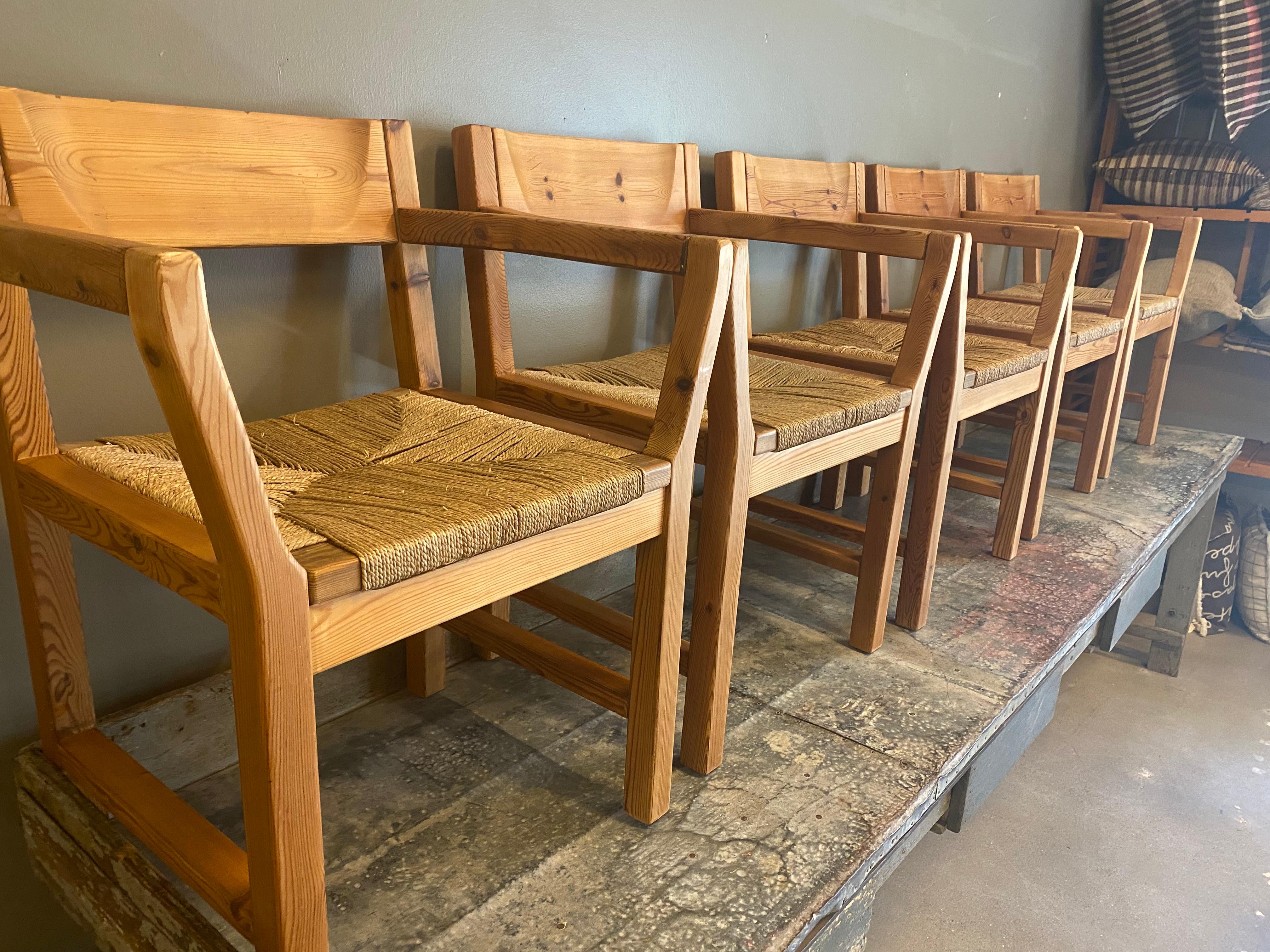 Scandinavian Modern style set of dining chairs with solid pine armed frames and rush seats. Very sturdy and comfortable. 1970's.