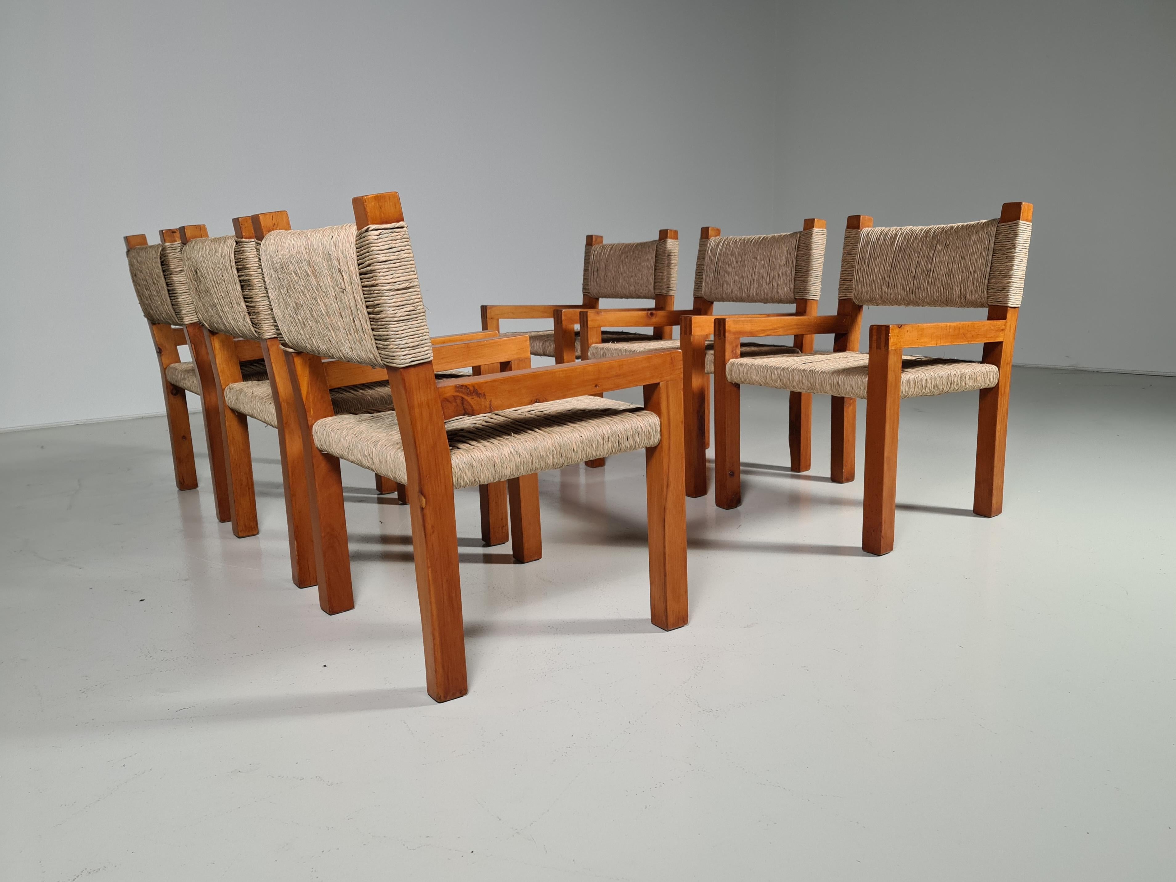 Rare set of pine dining chairs with woven paper cord seats. The elegant designed open shape of the frame in combination with the naturally colored seats makes this chair very versatile for any type of interior. The design looks simplistic, yet these