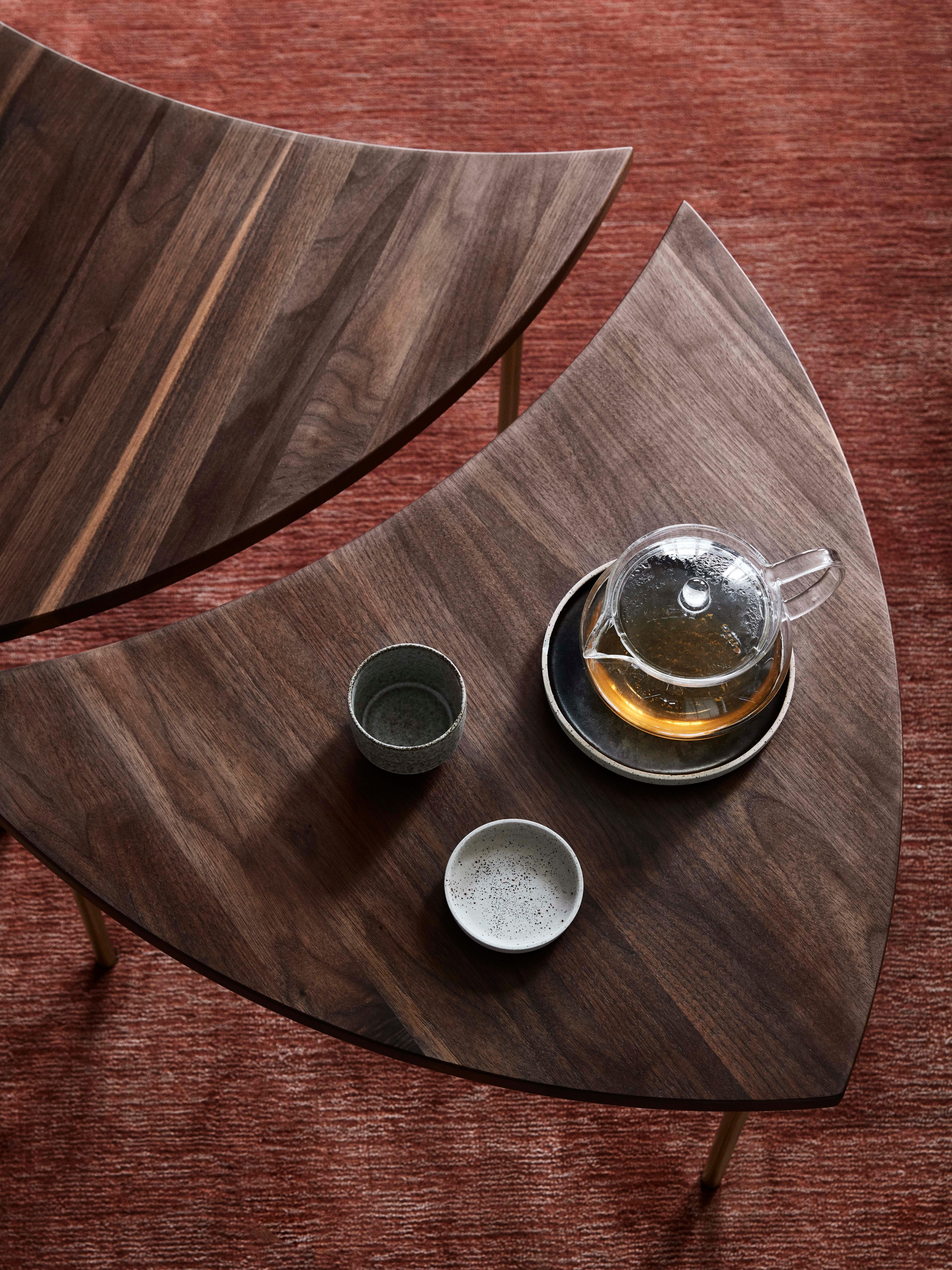 Slim and shapely, Hvidt & Mølgaard’s Pinwheel table from 1953 is a multipurpose piece. 
Designed to be adaptable, it boasts a series of smaller tables that can be slotted together to form one elegant and unique piece. Available in Oiled walnut, its