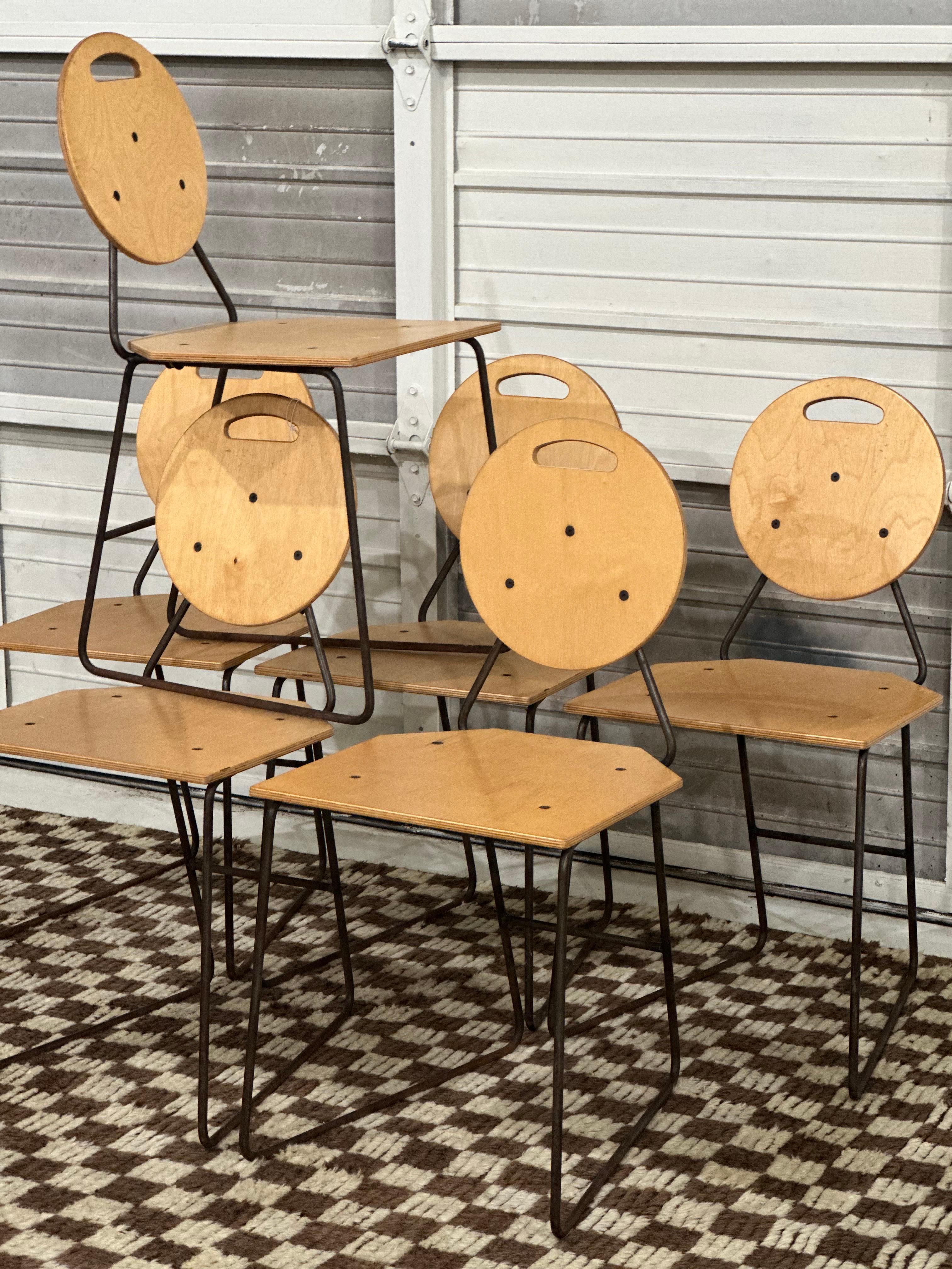 Set of 6 plywood and iron post-modern industrial style dining height chairs in the manner of Bruce Gueswel. Minor scratches and fading consistent with age. Some light rust present on iron frame. Chairs are in otherwise excellent vintage condition