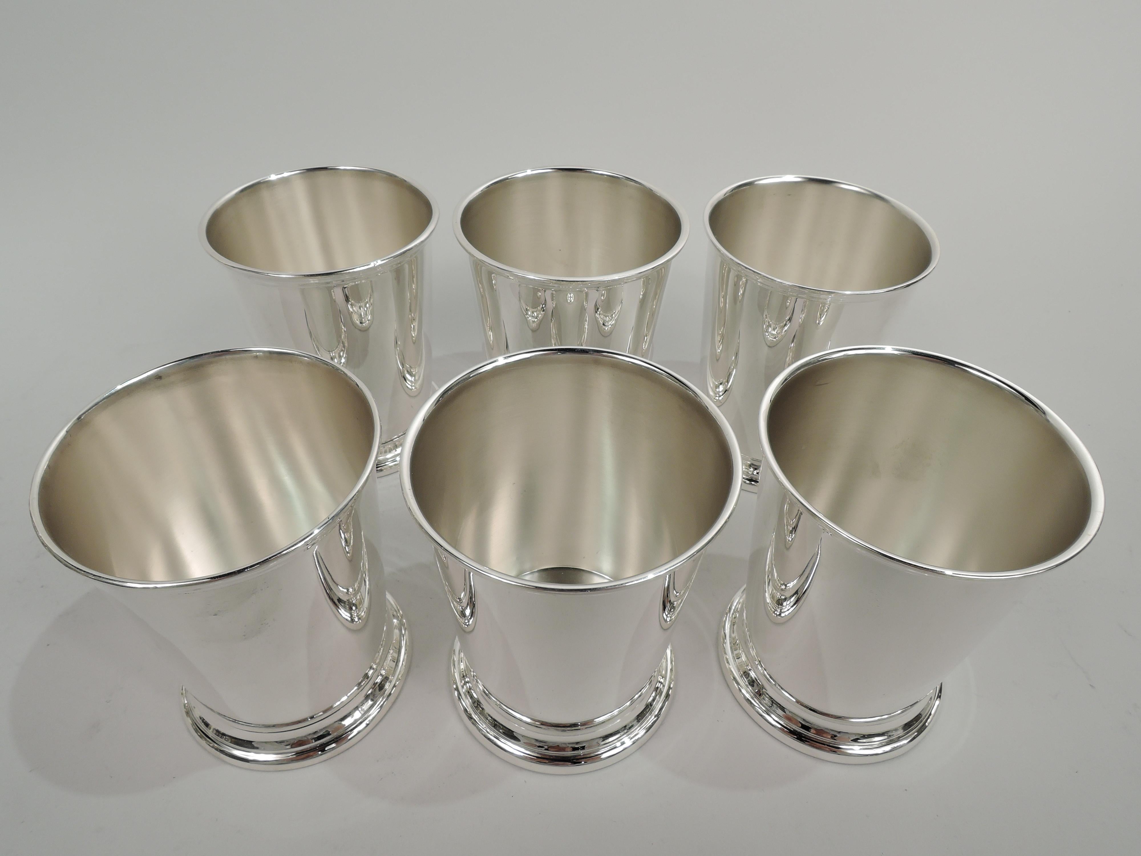 Set of 6 sterling silver mint julep cups. Made by Poole in Wallingford, Connecticut. Each: Straight and tapering sides, molded rim, and skirted foot. Marked “Sterling by Poole” and numbered 58. Total weight: 17.5 troy ounces.