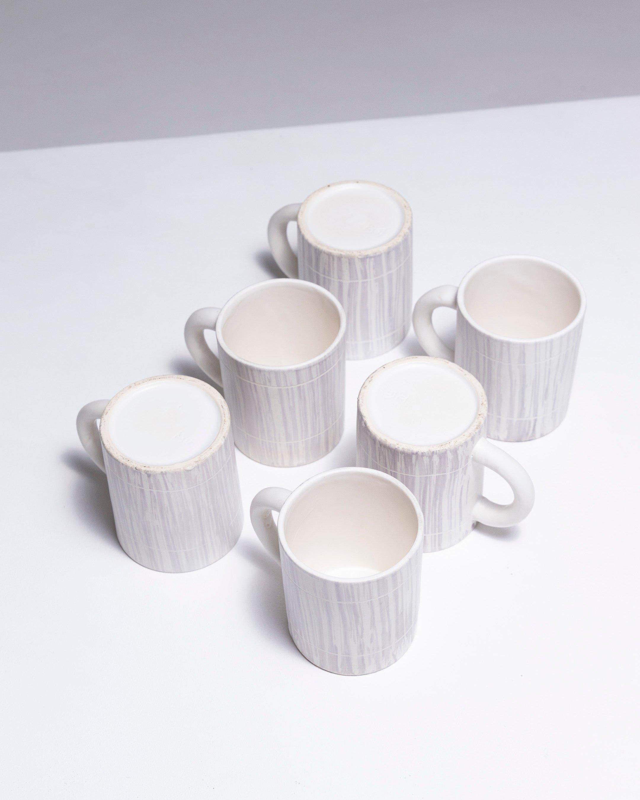Set of six Porcelain cups by Fasold & Stauch, 1960s. Straight-sided with a vertical stripe decor. German origin, manufactured by Fasold & Stauch in Boch-Wallendorf, and decorated in Pornic. Signed on the underside with two crowned C's. In good