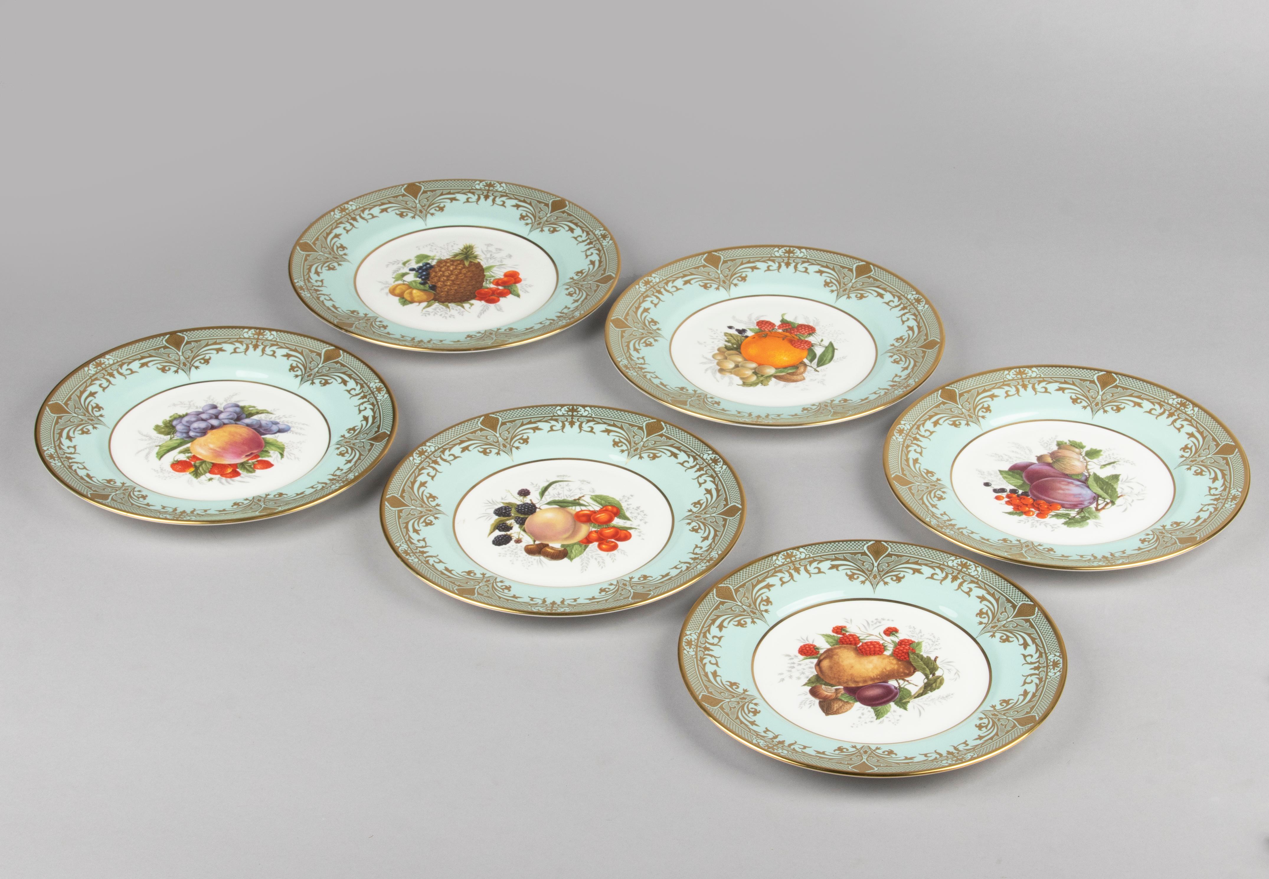 Beautiful set of six porcelain dinner plates, from the English brand Caverswall. The plates are decorated with different images of fruit and wide mint-coloured rims. The plates are decorated with elegant gold decorations. The plates are in very good