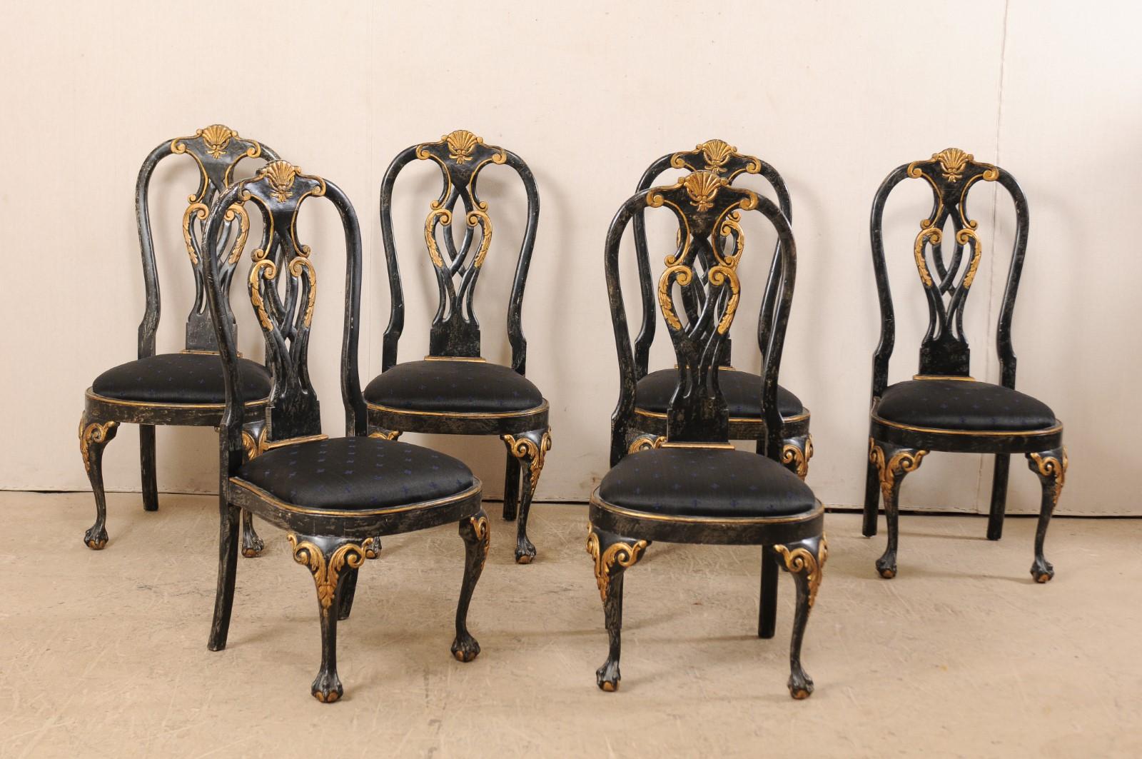A set of six Portuguese style dining side chairs. This set of American side chairs, in Portuguese design, each feature nicely decorated backs with shell centered rocaille at top rail, above a pierced splat back. Front knees are emphasized with