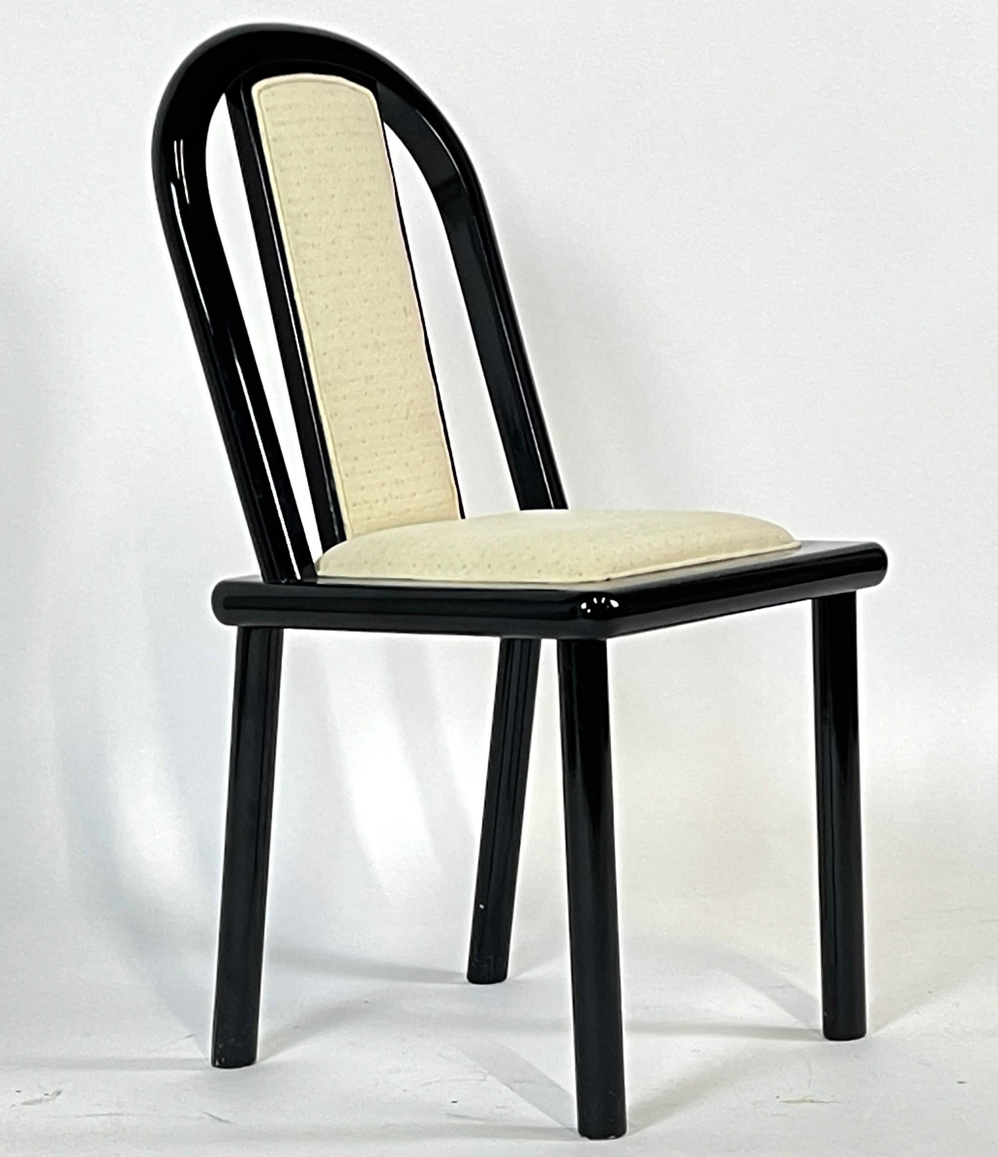 Sturdy set of 4 chairs from the 1980s. Sleek Postmodern style in fabulous black lacquer finish.