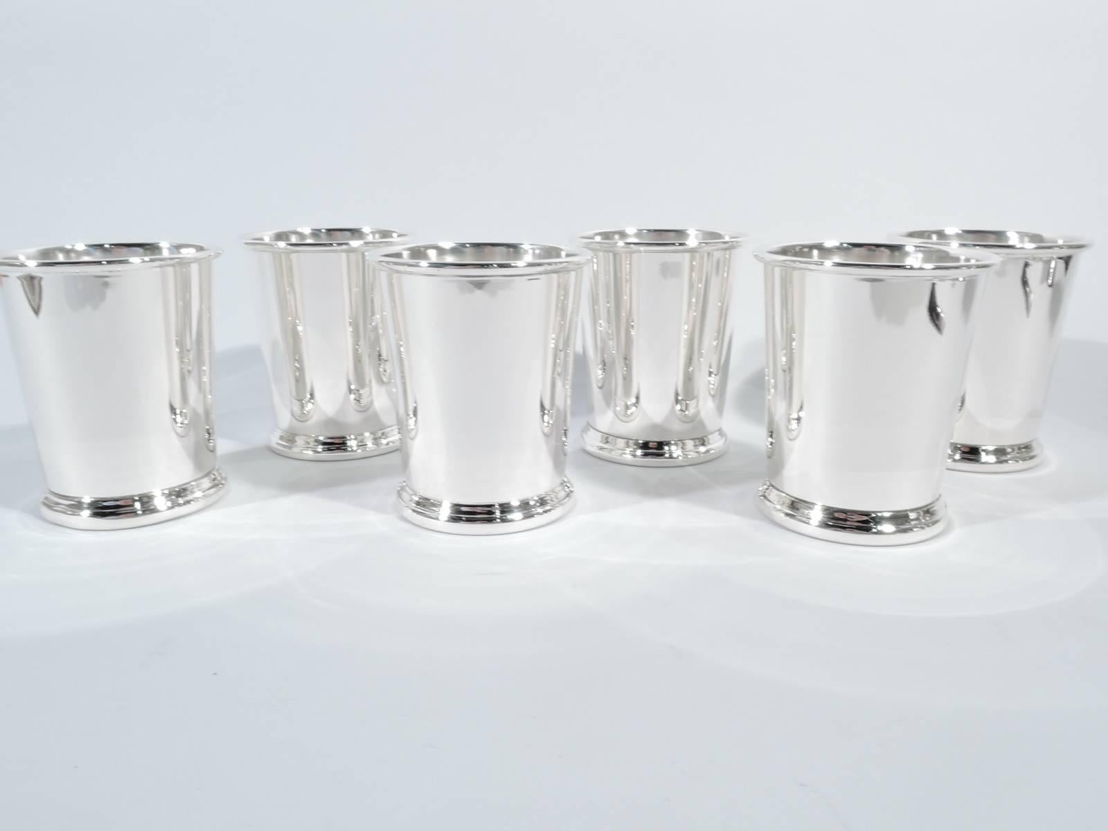 Set of six sterling silver mint julep cups. Made by Preisner in Wallingford, Conn. Each: Straight and tapering sides, molded rim, and skirted foot. Hallmark includes no. 140. Total weight: 28 troy ounces.
