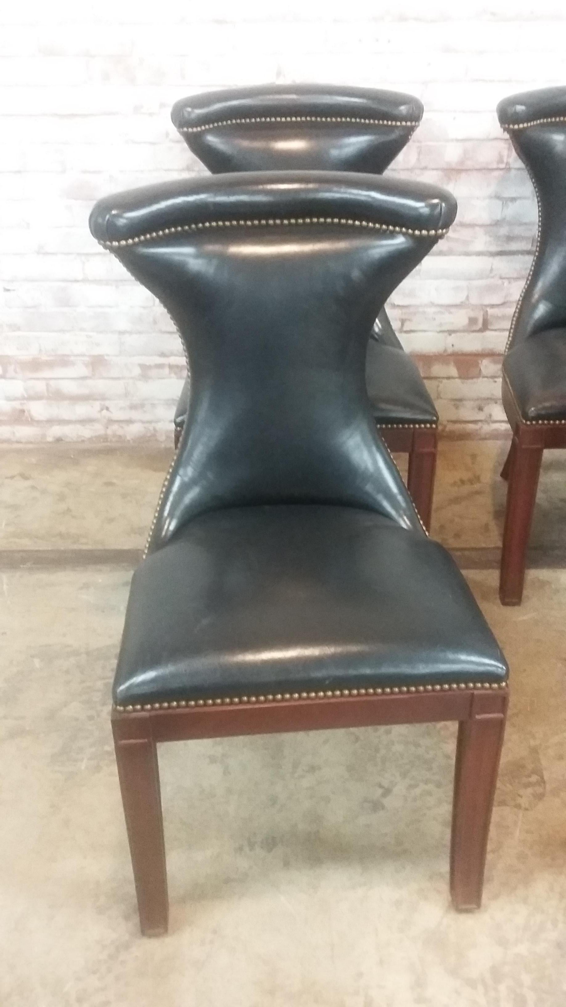 Terrific set of 6 leather dining chairs signed Ralph Lauren. Great leather chairs with brass nailheads along the back and sides of each chair. Mahogany finish to the fluted, carved legs. Nicely padded curve to the top of each one. Condition of each