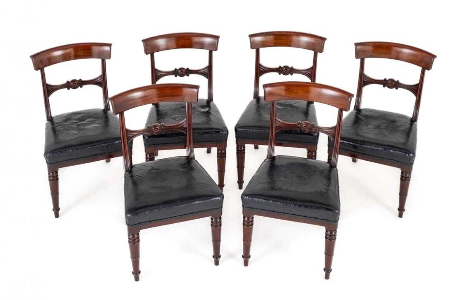 Set of 6 regency mahogany dining chairs.
The chairs are raised upon ring turned front legs with swept back legs.
The chairs feature leather stuff over seats.
The backs of the chairs having fluted uprights and a carved and turned centre rail.
The