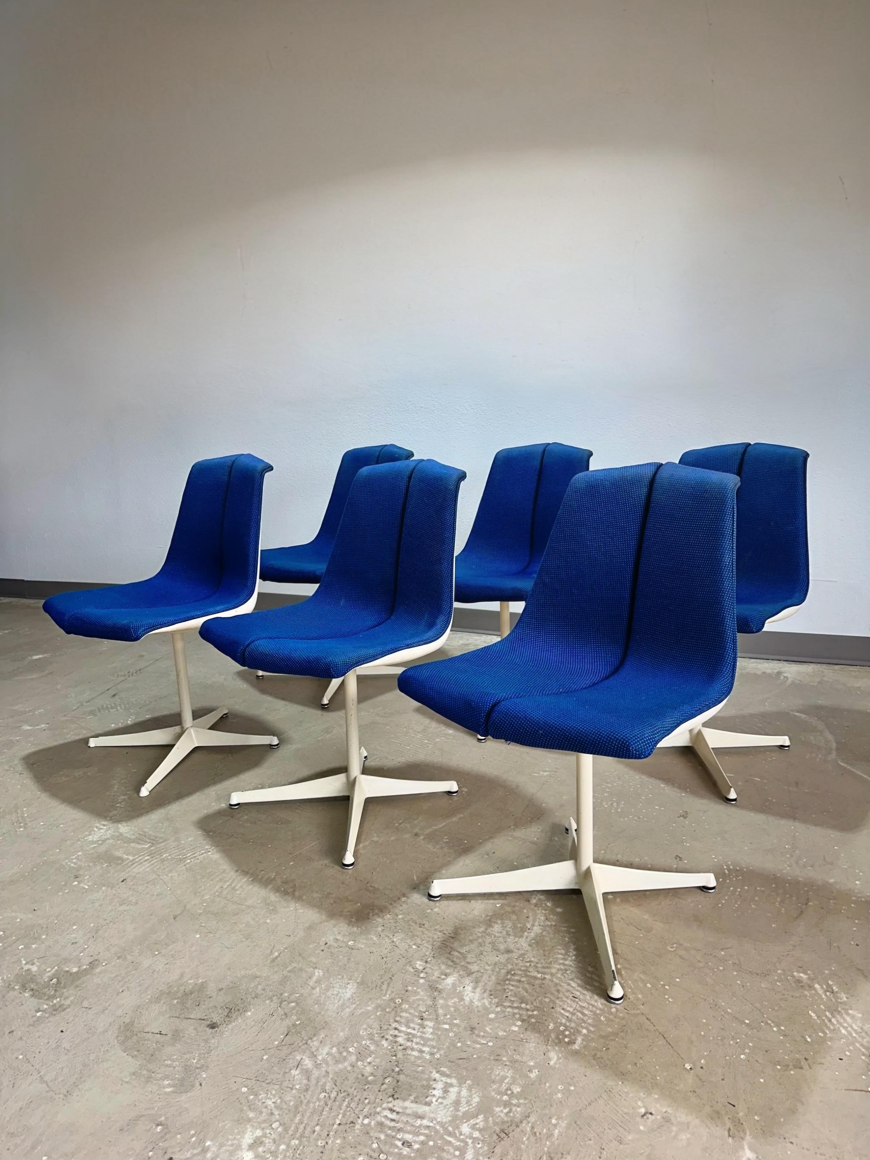 Mid Century Modern Space Age Dining Chairs designed by Richard Schultz for Knoll Circa 1960’s. White frames with blue upholstery, an uncommon set with angled frames and split seat design. Early knoll labels on underside of some chairs. Chairs are on