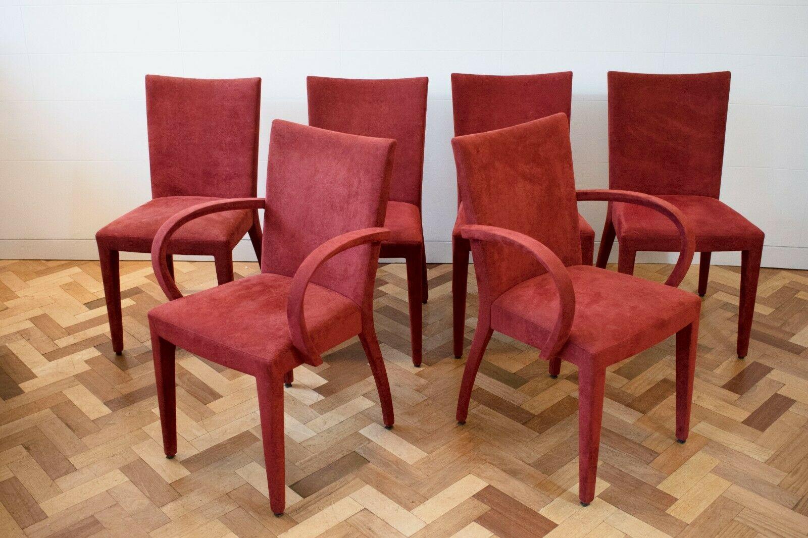 A Set of 6 dining chairs by French interior company 'Roche Bobois' 

This set comprises of 6 chairs, 4 without arms and two carvers. 

The set is upholstered in a dark red Suede, great pre used condition. 


About the designer:

Roche Bobois are