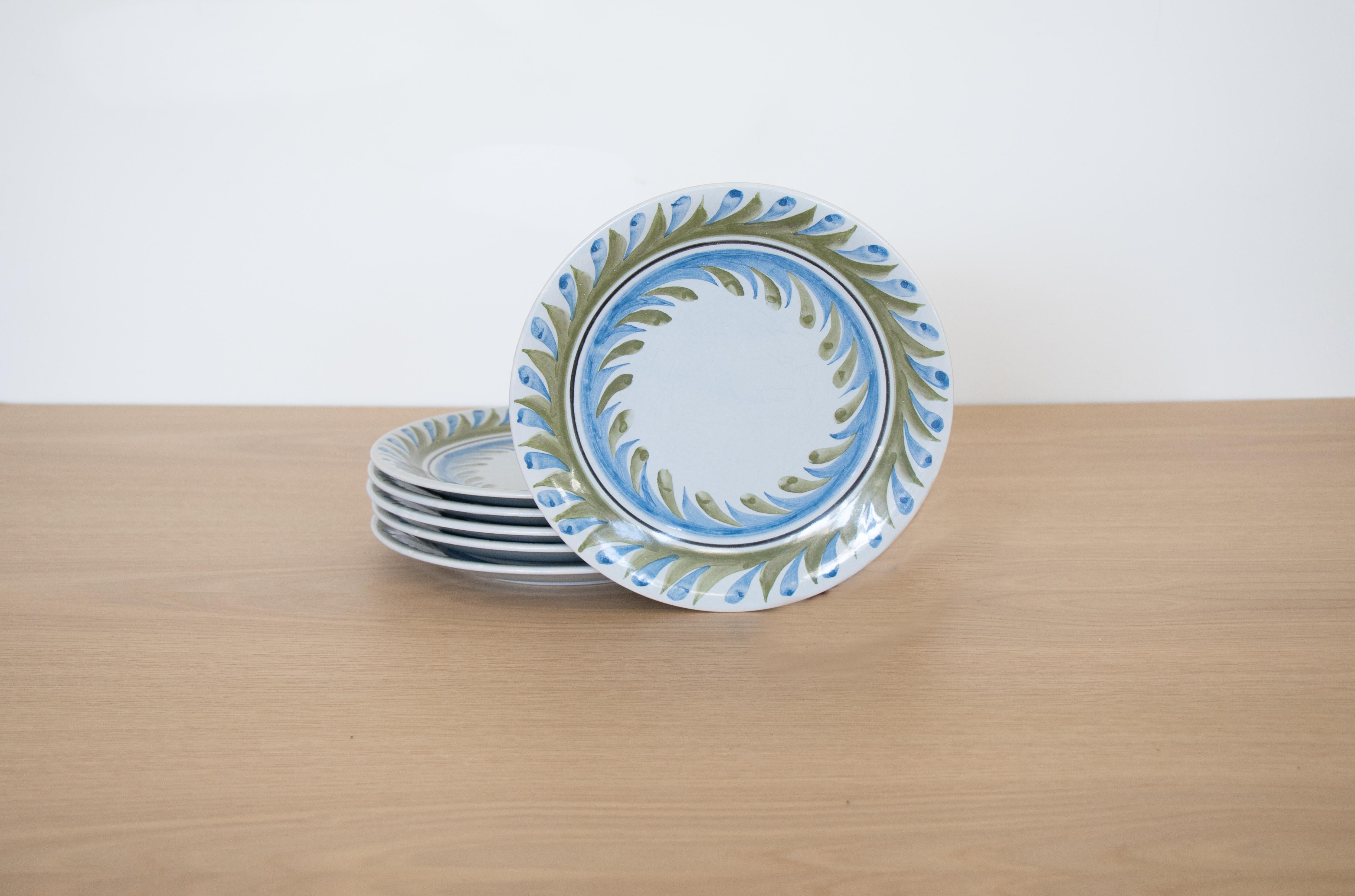 Incredible set of 6 painted plates by Roger Capron from France, 1950s. Beautiful hand painted blue and green leaf motif on slightly tinted blue ceramic plate. Signed on back.