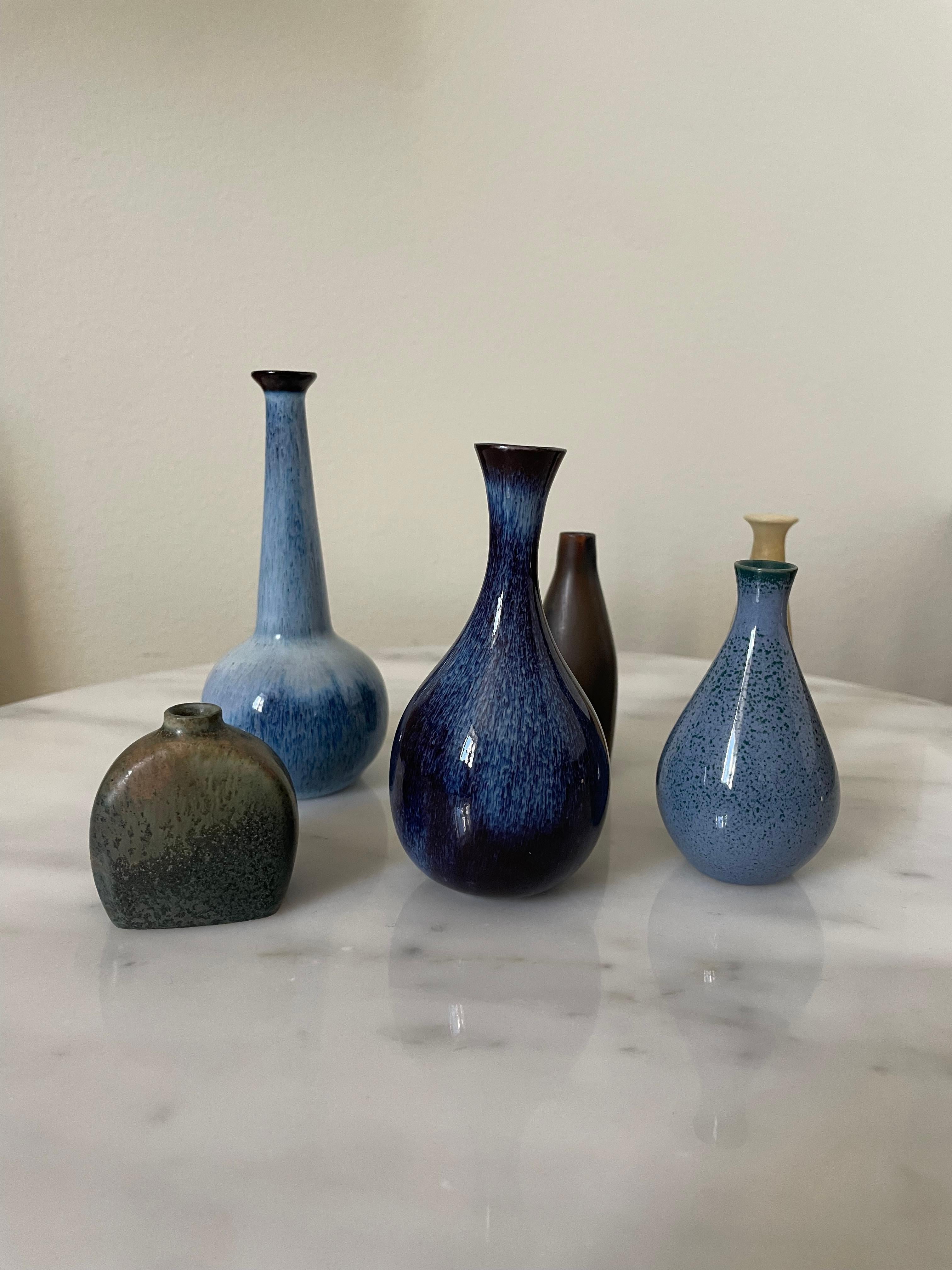 Beautiful set of six signed Rörstrand miniature vases, all first quality. The set comprises two by Carl-Harry Stålhane, three by Gunnar Nylund, and one by Bertil Lundgren. Each vase highlights the designers’ distinctive styles and Rörstrand’s