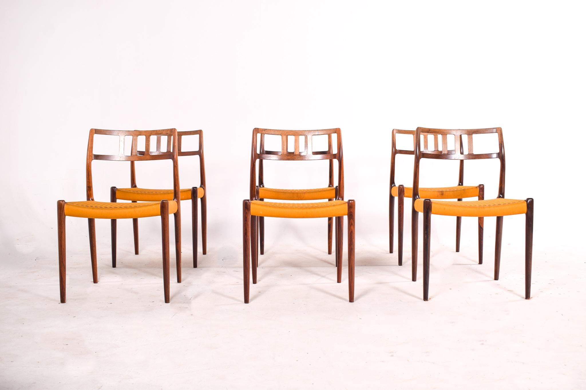 Set of 6 rosewood dining chairs by Niels Moller, model 79. This chairs manufactured by J.L. Møller Mobelfabrik are among the most sought Danish chairs. This chairs offer comfortable seating with good back support. The seat is made of braided flat