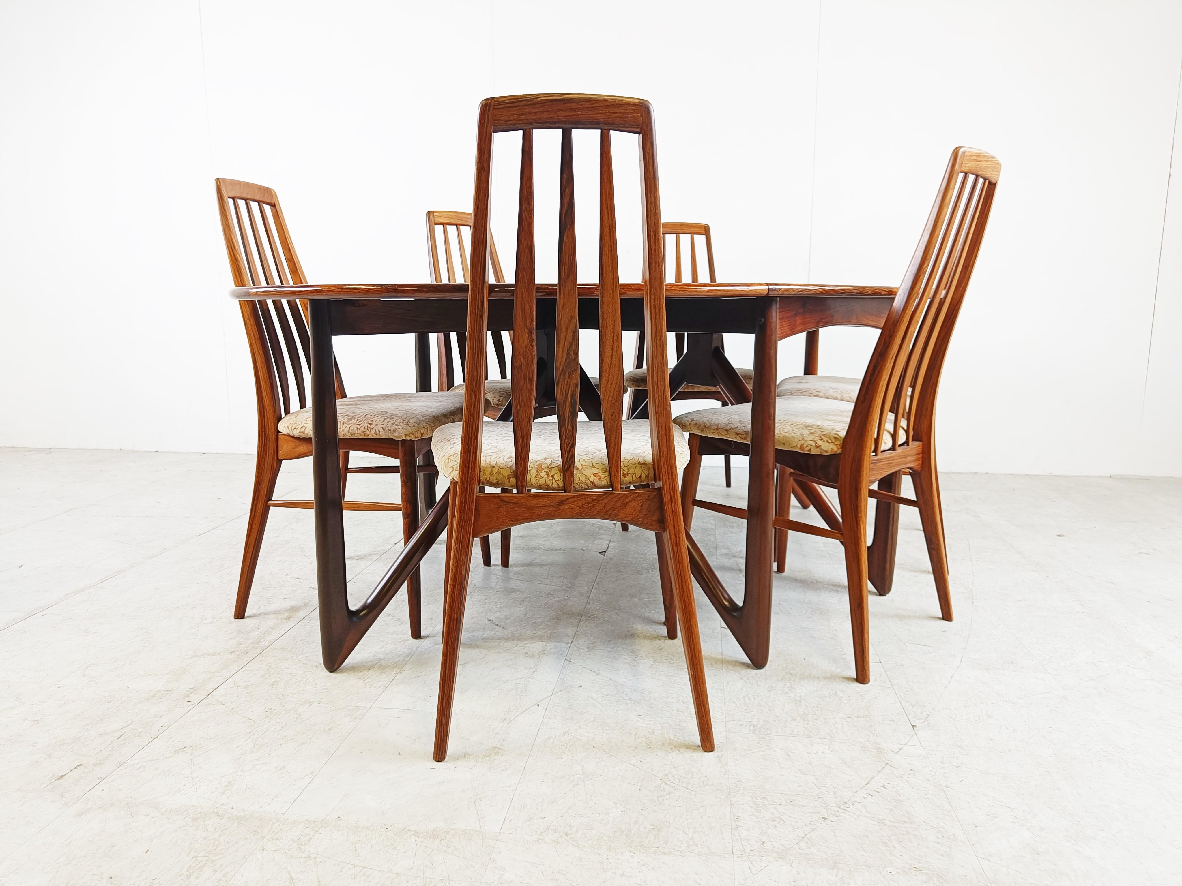 Mid century rosewood 'Eva' dining chairs with original period upholstery. We can upholster the seats in other plain fabrics or bouclé fabric as well. - Contact us for info. 

The chairs are made with an eye for detail and every piece of the chairs