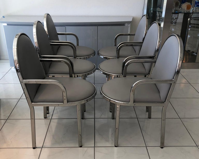 A gorgeous set of 6 chrome dining chairs by Rougier. These dining chairs feature a great modern or Postmodern and even slightly Art Deco design. 

These mid century modern / post modern chairs are definitely evocative of Milo Baughman or even Pierre