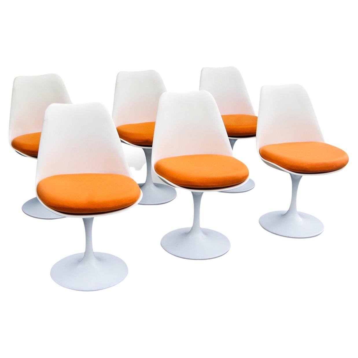 1960s set of 6 Eero Saarinen fibreglass Tulip Swivel dining chairs. 
Licensed and manufactured by Rudi Bonzanini.
Tulip shaped swivel action fibreglass shells, bolted onto powder coated steel weighted bases. 
The chairs come with 6 cushions in