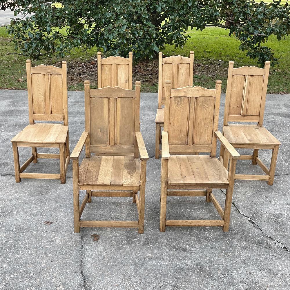 Set of 6 rustic antique country French dining chairs includes 2 Armchairs and was fashioned from old-growth oak to last for centuries! Solid planks on the seat backs and seats combine with a sturdy framework with tailored lines for a casual effect,