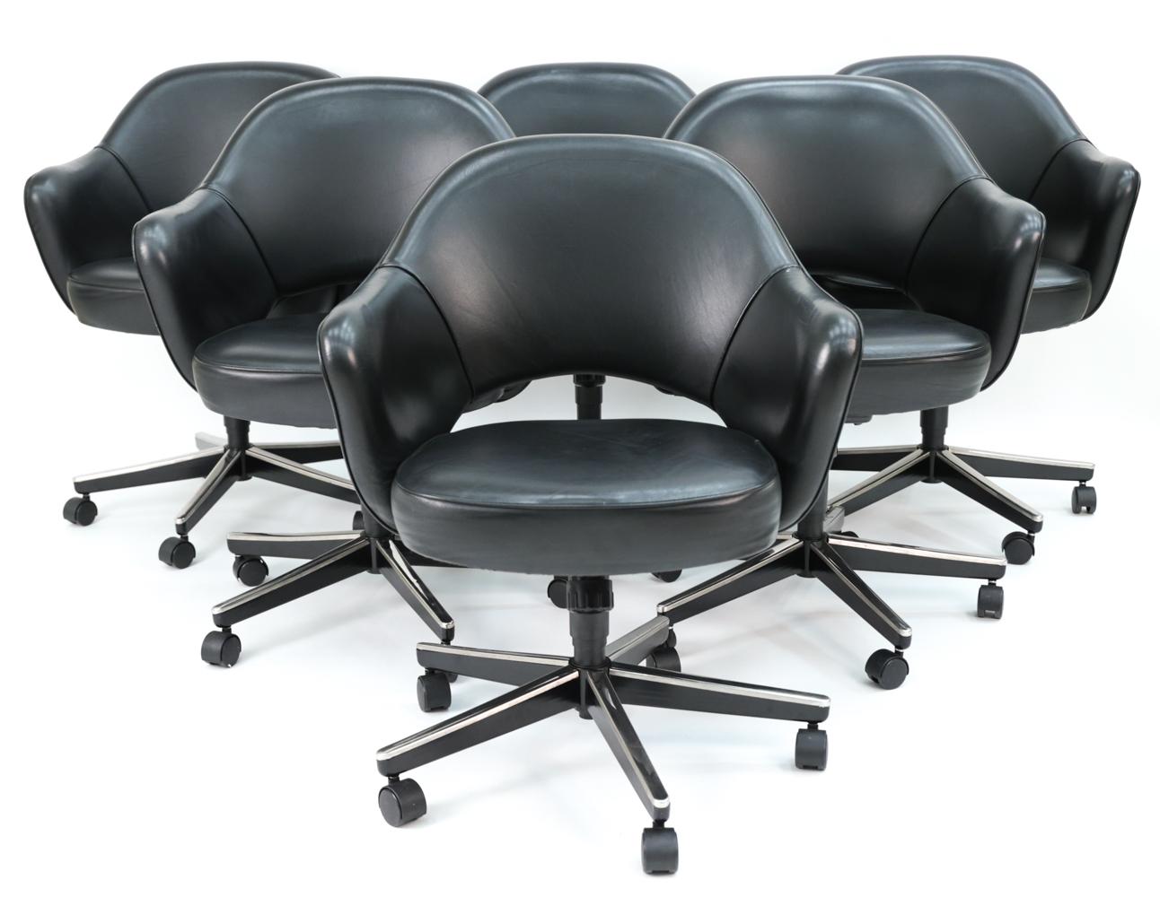 Set of (6) contemporary Eero Saarinen executive armchairs, with rolling swivel bases and black Volo leather upholstery, circa 2004.
Featured in nearly all Florence Knoll-designed interiors, the Saarinen executive chair has remained one of Knoll's