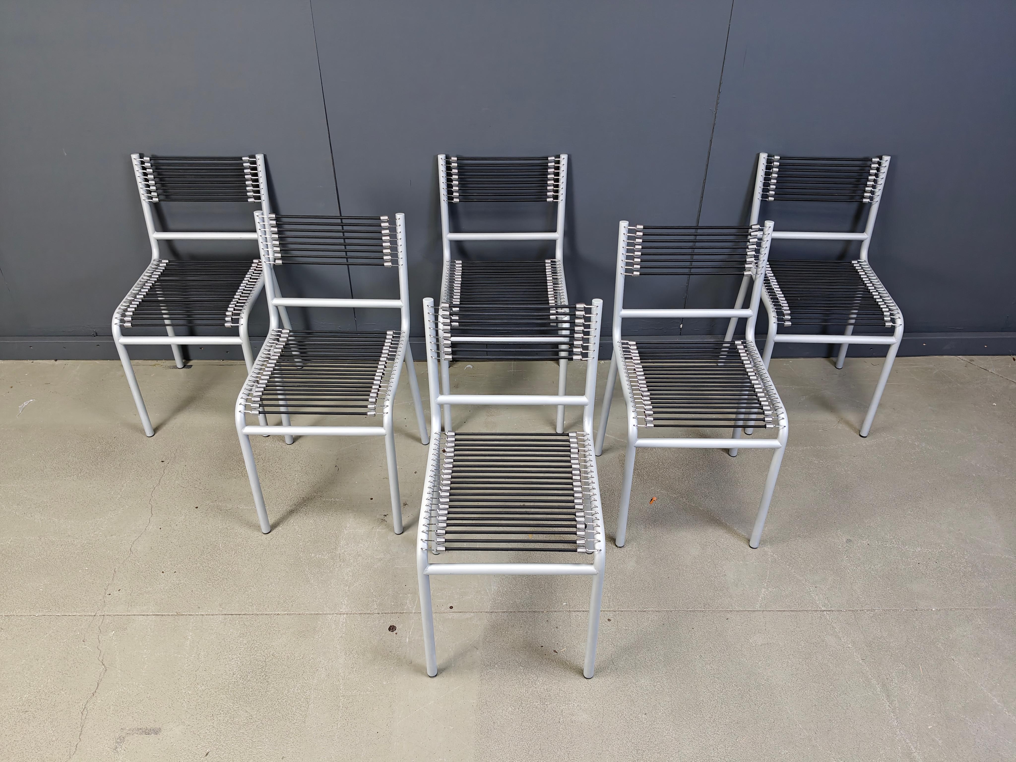 Vintage grey metal dining chairs with elastic cords designed by rene Herbst in the bauhaus period and produced in the 1980s

Very good condition.

1980s - Italy

Dimensions:
Height: 80cm
Width: 42cm
Depth: 42cm
Seat height: 45cm

Price is for the
