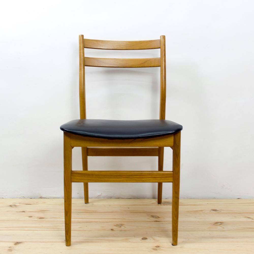This set of 6 Scandinavian style chairs have clean lines and a natural stained Ash wood base. The Ash wood base is a light warm golden color and has very smooth dowel legs. The backrest is almost completely open with only two support bars across the