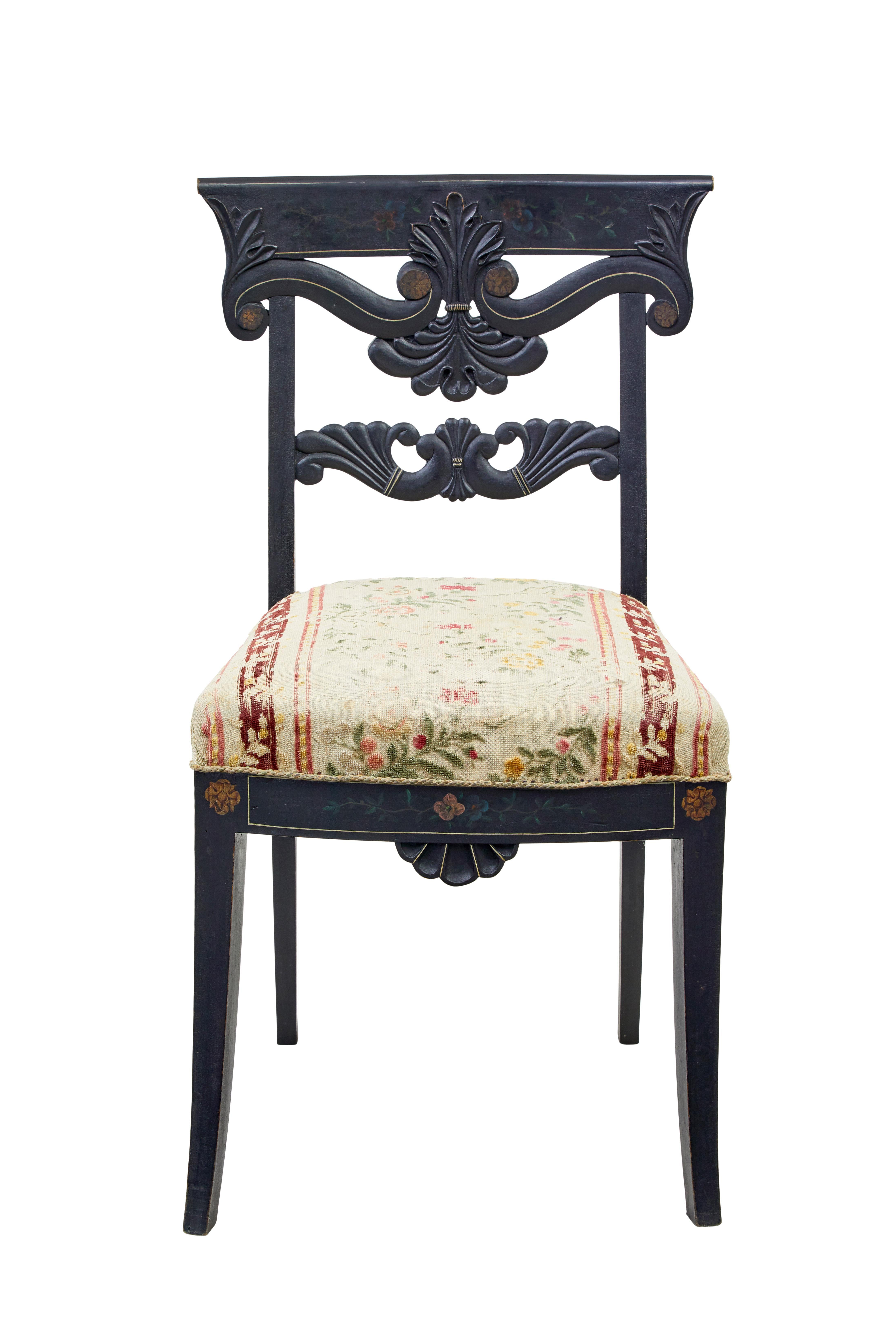Set of 6 Scandinavian carved and hand painted dining chairs circa 1890.

Fine set of chairs made from solid beech, painted black with hand painted elements to the back rest and front rail.  Carved scrolling back rest and shell detail to front