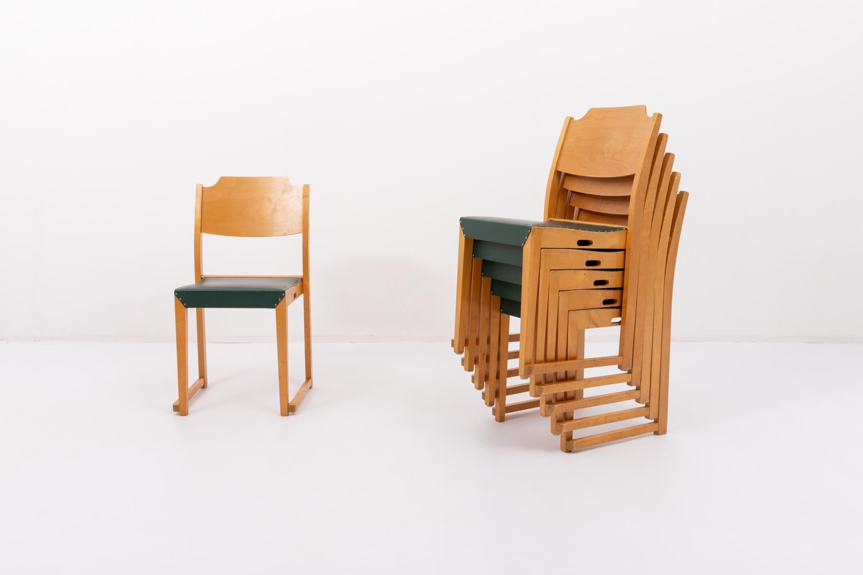 Set of six stackable chairs designed by Herman Seeck for Asko, Finland 1950s. It has a varnished birch frame with green galon seat upholstery.

Priced per set of 6.

Condition
Good, age related wear and marks

Dimensions
width: 45 cm
height: 85