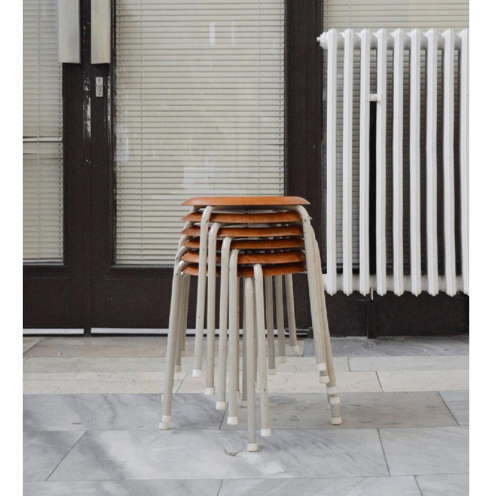 Set of 6 Scandinavian stackable stools from the 1950s.

Featuring an incredibly beautiful design, each stool features bent tubular metal legs and a round seat made entirely from teak wood. These stools were designed in a very clean shape, and each