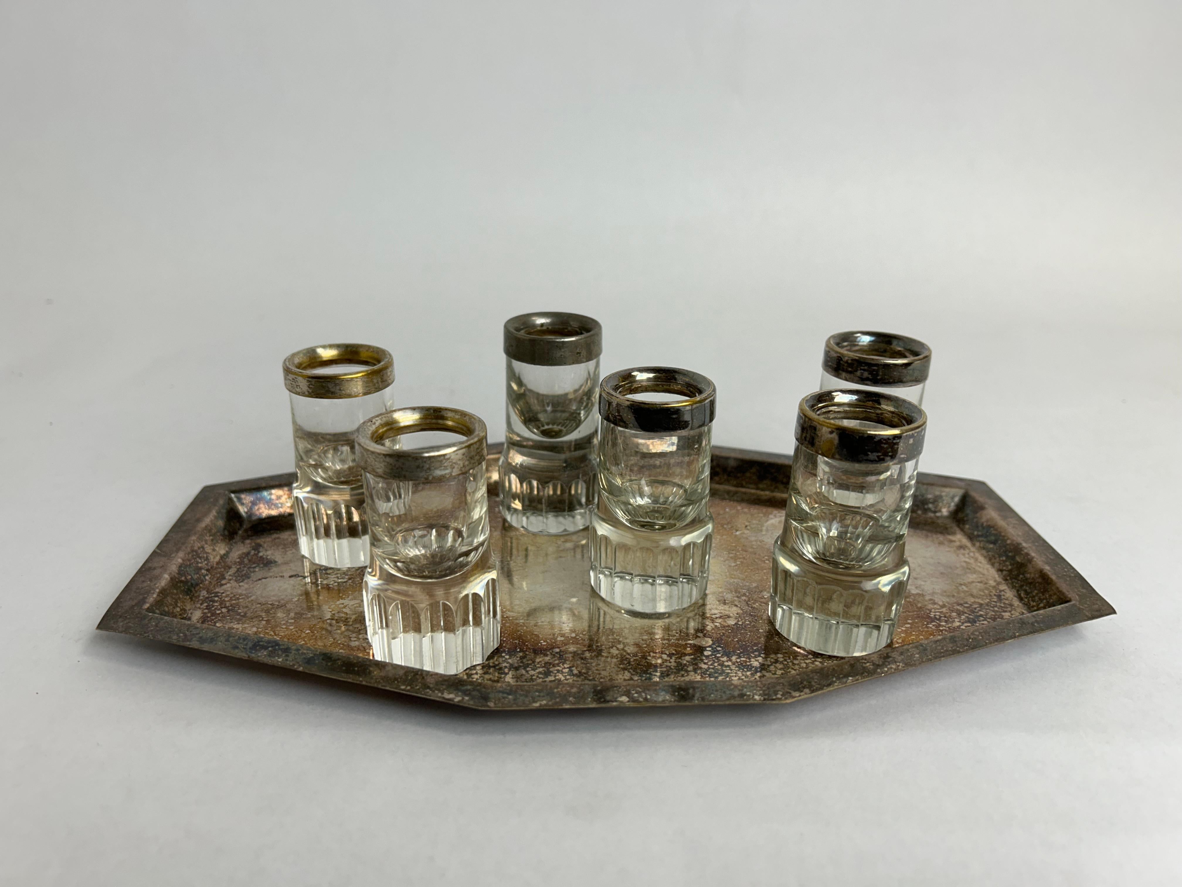 Set of 6 shot glasses by Adolf Loos for Bakalowits & Söhne with brass edge. Alpaca tray. Original vintage condition with signs of use.