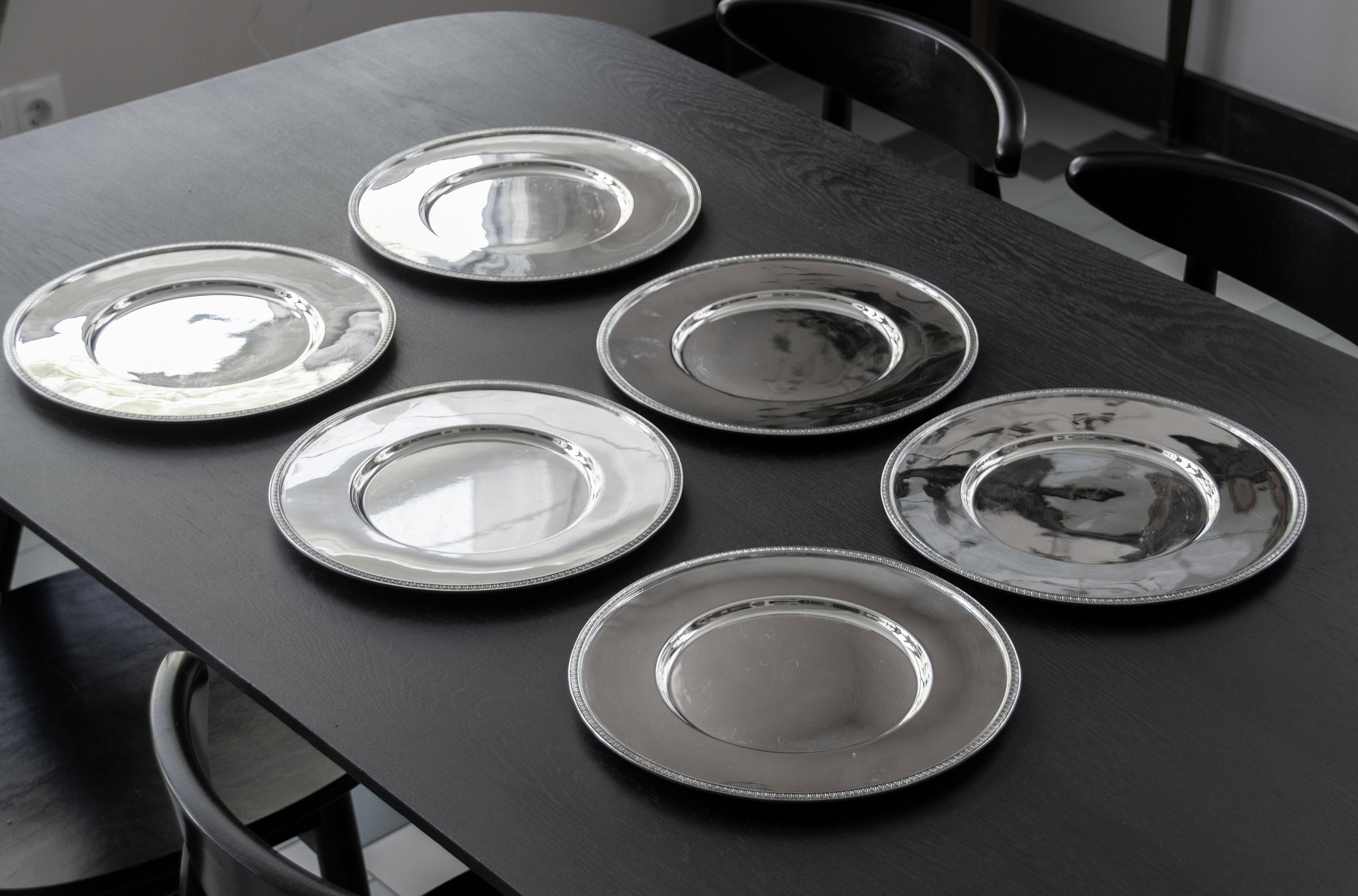 Great set of 6 silver plated under plates from the French brand Christofle. The plates are used as coasters for porcelain tableware, but they are also suitable for use as a serving dish. The plates are issued in the Malmaison series. The plates are