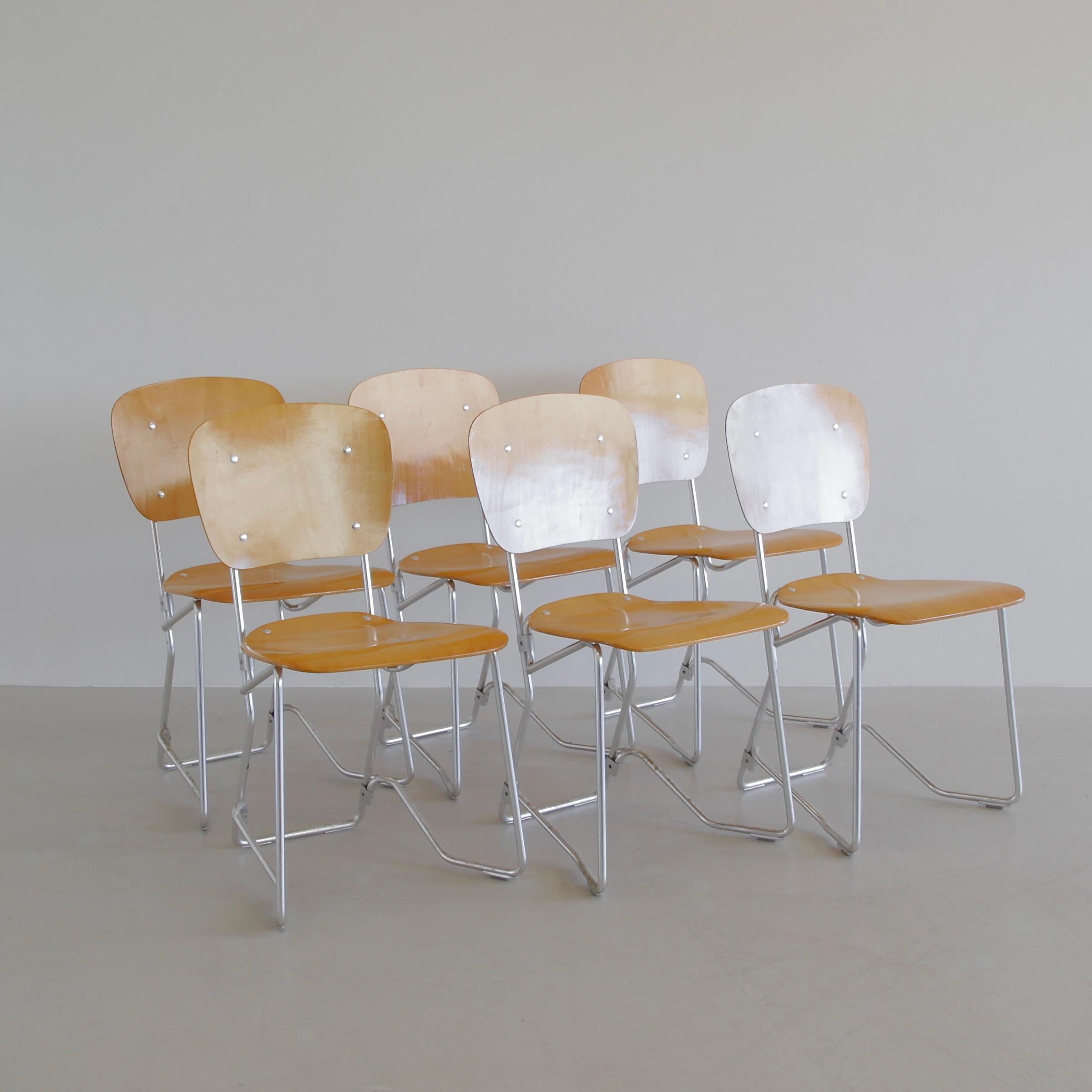 A beautiful set of six (6) stackable bentwood chairs, designed by Armin Wirth in the 1950s. Light aluminium frame with birch seat and backrest. Stacked together, they look like a wonderful sculpture, comfortable to sit on and super