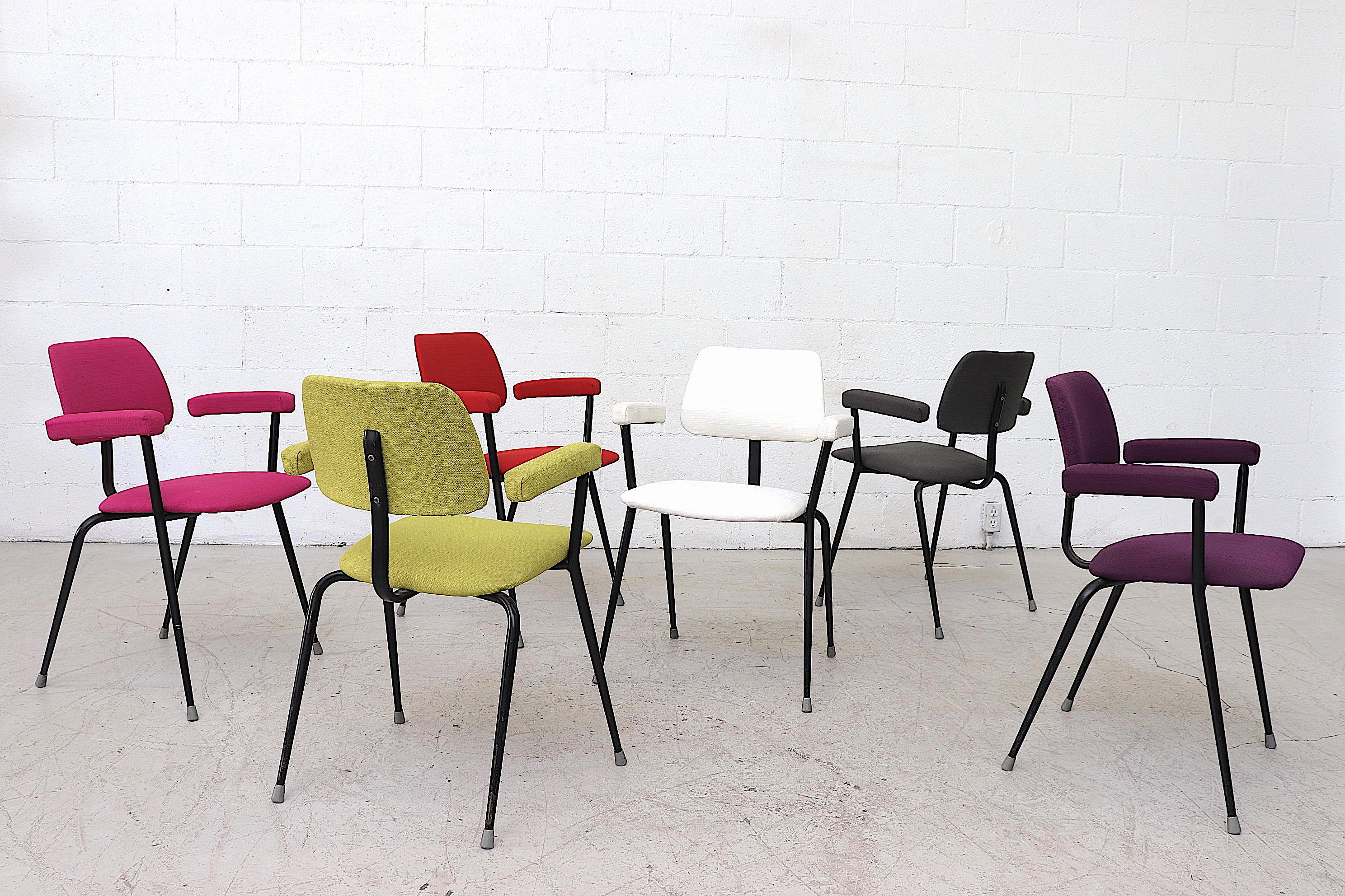 Set of 6 handsome tubular stacking chairs with brightly upholstered seat, back and arm rests. Frames are in original condition with visible signs of wear. Set price.