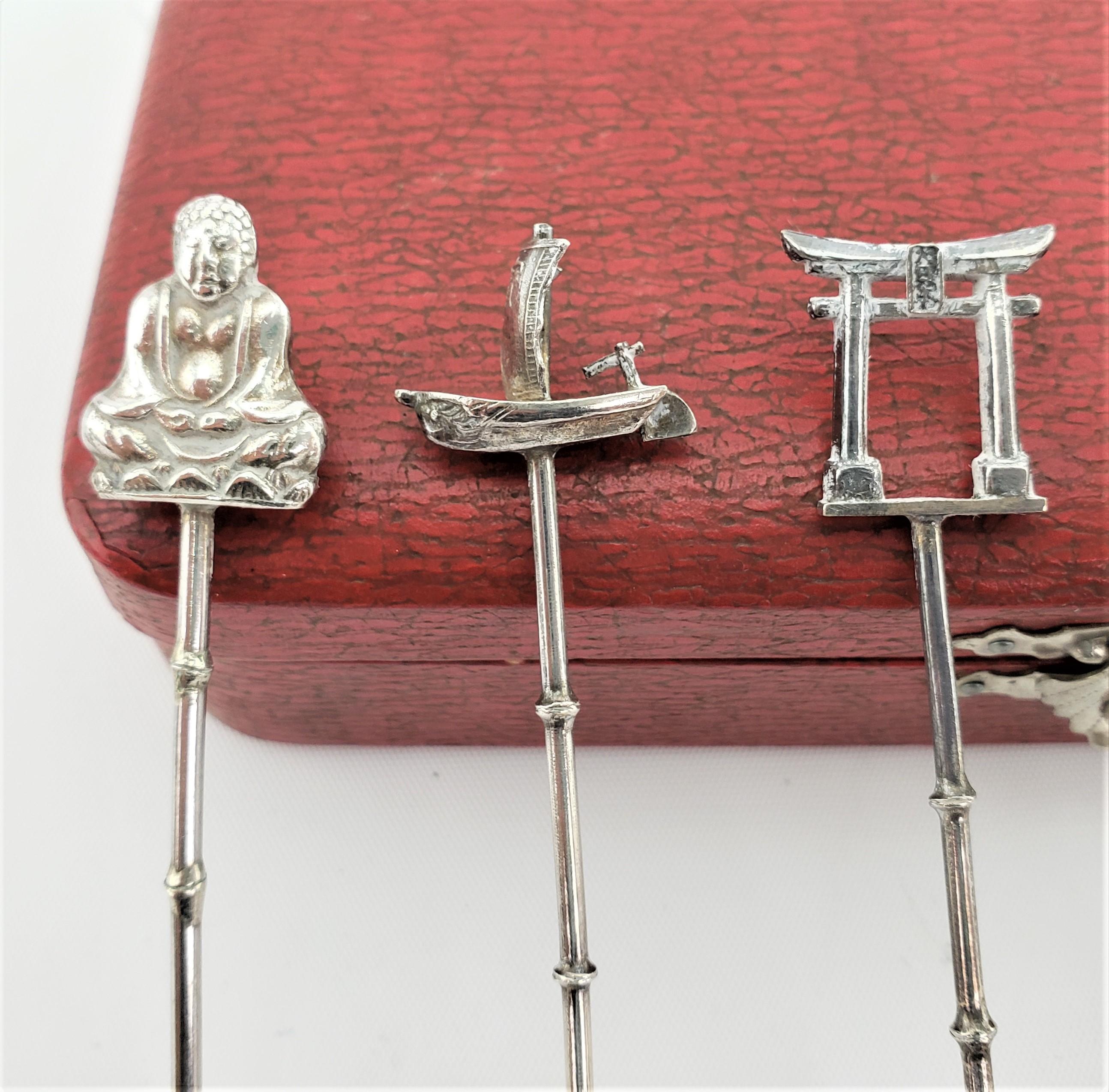 This boxed set of six figural silver souvenir of the Imperial Hotel coffee or espresso spoons were made by the Okubo Brothers of Japan in approximately 1950 in an Anglo-Japanese style. The top of each spoon is done with a figural symbol of the