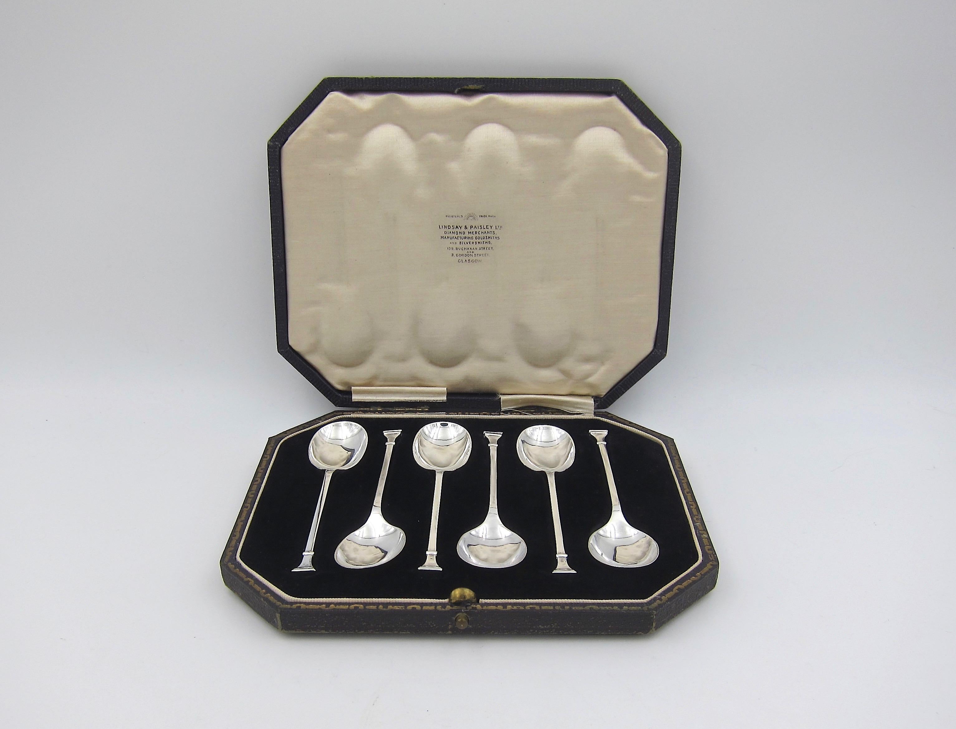 A handsome boxed set of six sterling silver coffee spoons made by Cooper Brothers and Sons of Sheffield, England in 1925. The vintage silver spoons include their original fitted box from Lindsay & Paisley LTD of Glasgow. 

Each solid silver handle
