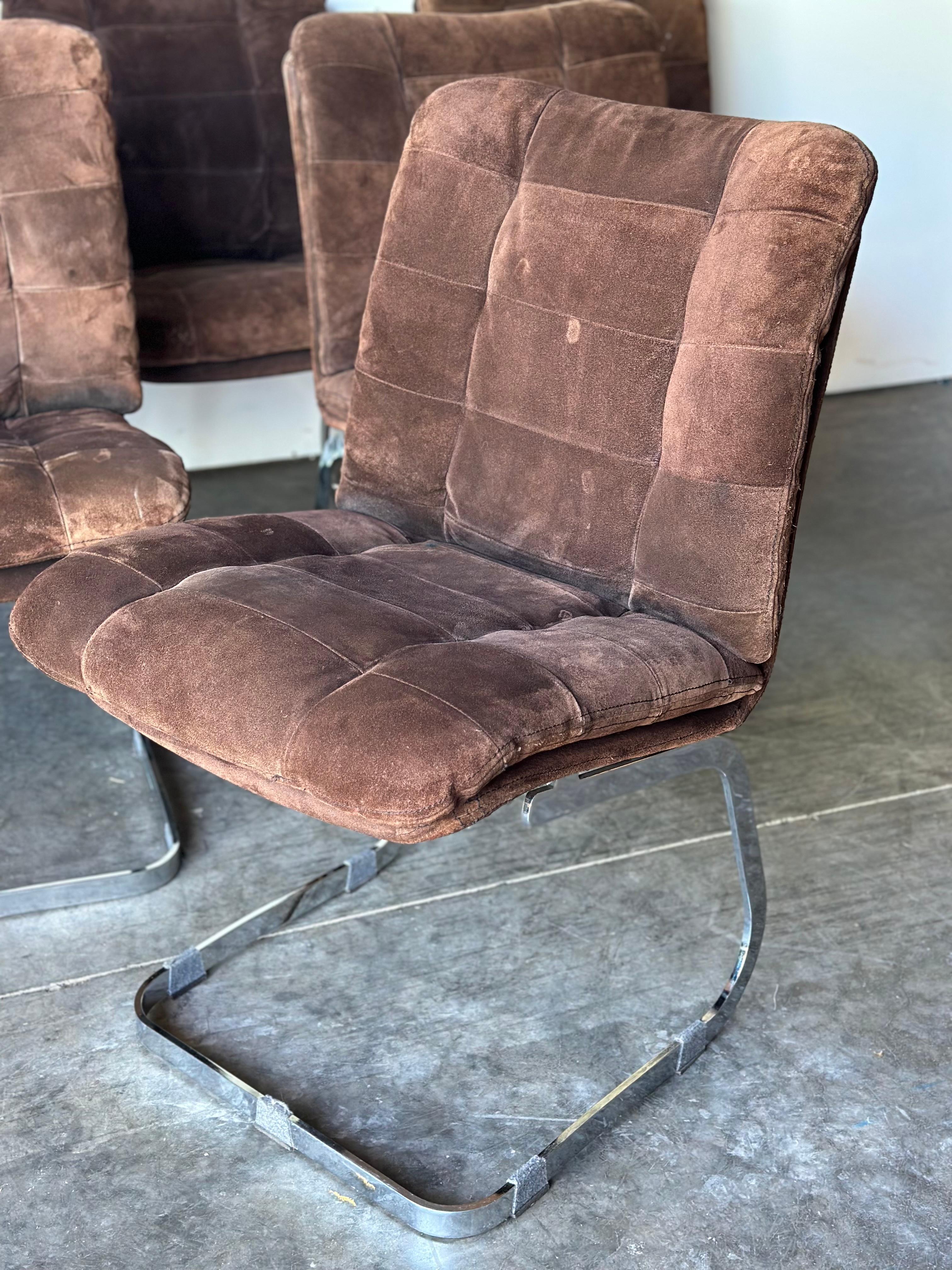 Set of 6 chairs by Roche Bobois. Perfect for dining but could be used in any setting such as an office or studio. These chairs have the ability to blend seamlessly with a variety of styles and are sure to make a statement. The original sueded