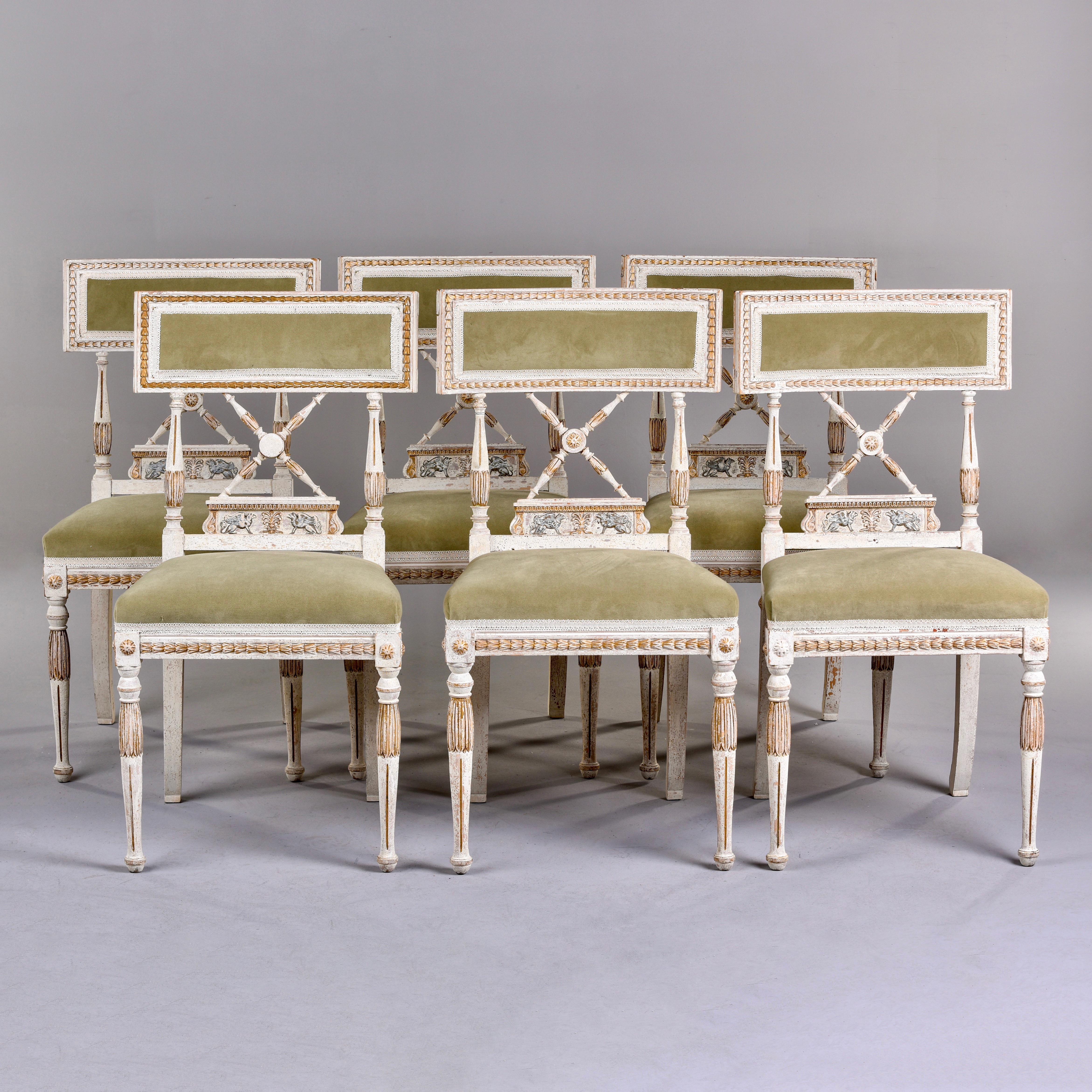 Circa 1900 Swedish set of six dining chairs in traditional style with carved a gilded details. New upholstery in sage colored short-nap commercial velvet. Very good vintage condition. Coordinating settee listed under separate listing.