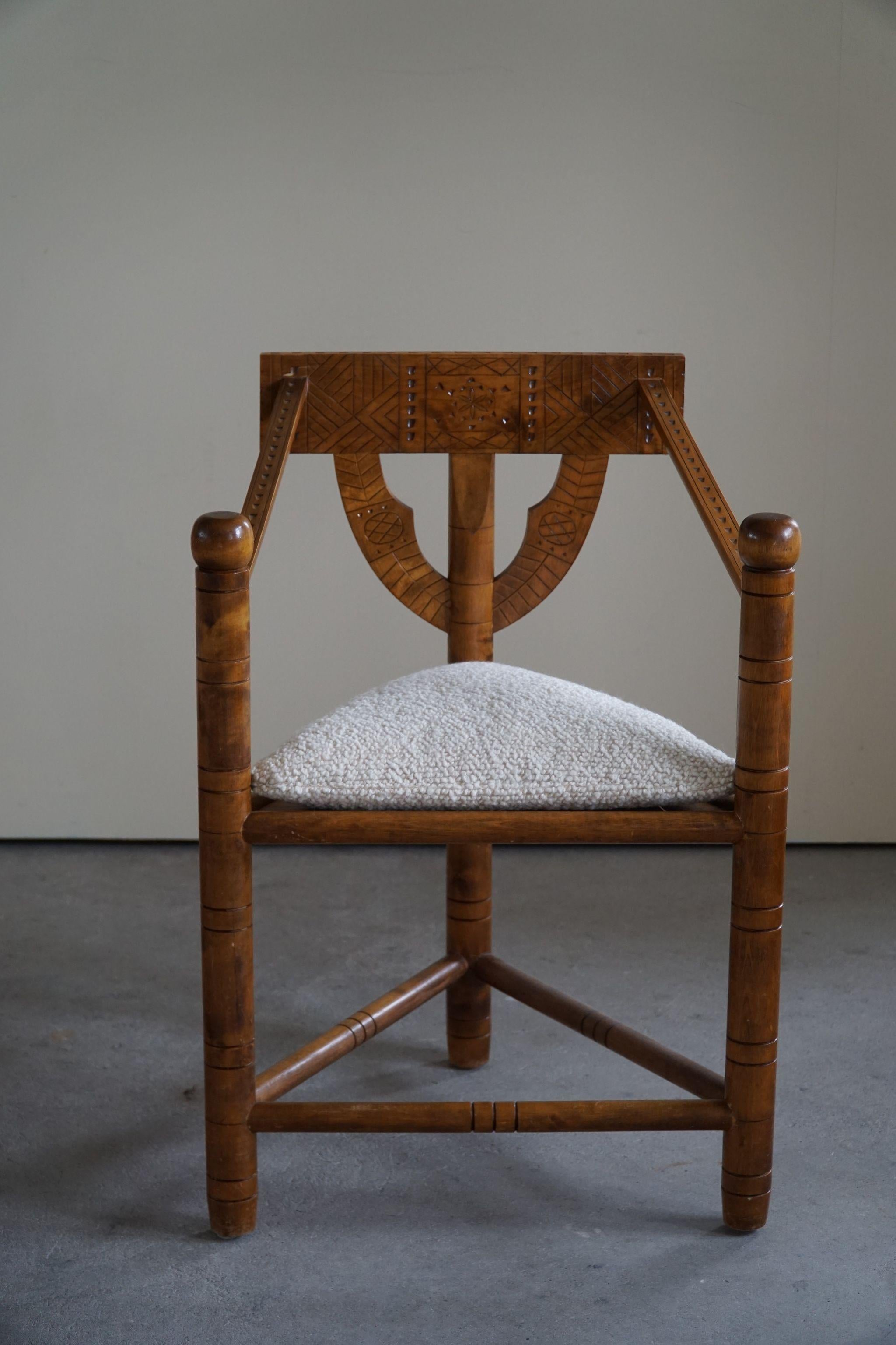 A set of 6 sculptural vintage Monk chairs made in solid oak. Carved by a Swedish cabinetmaker in the early 20th century. A truely authentic wabi sabi set in an overall good condition with a fine patina. 
Seats reupholstered in luxury Bouclé, Storr