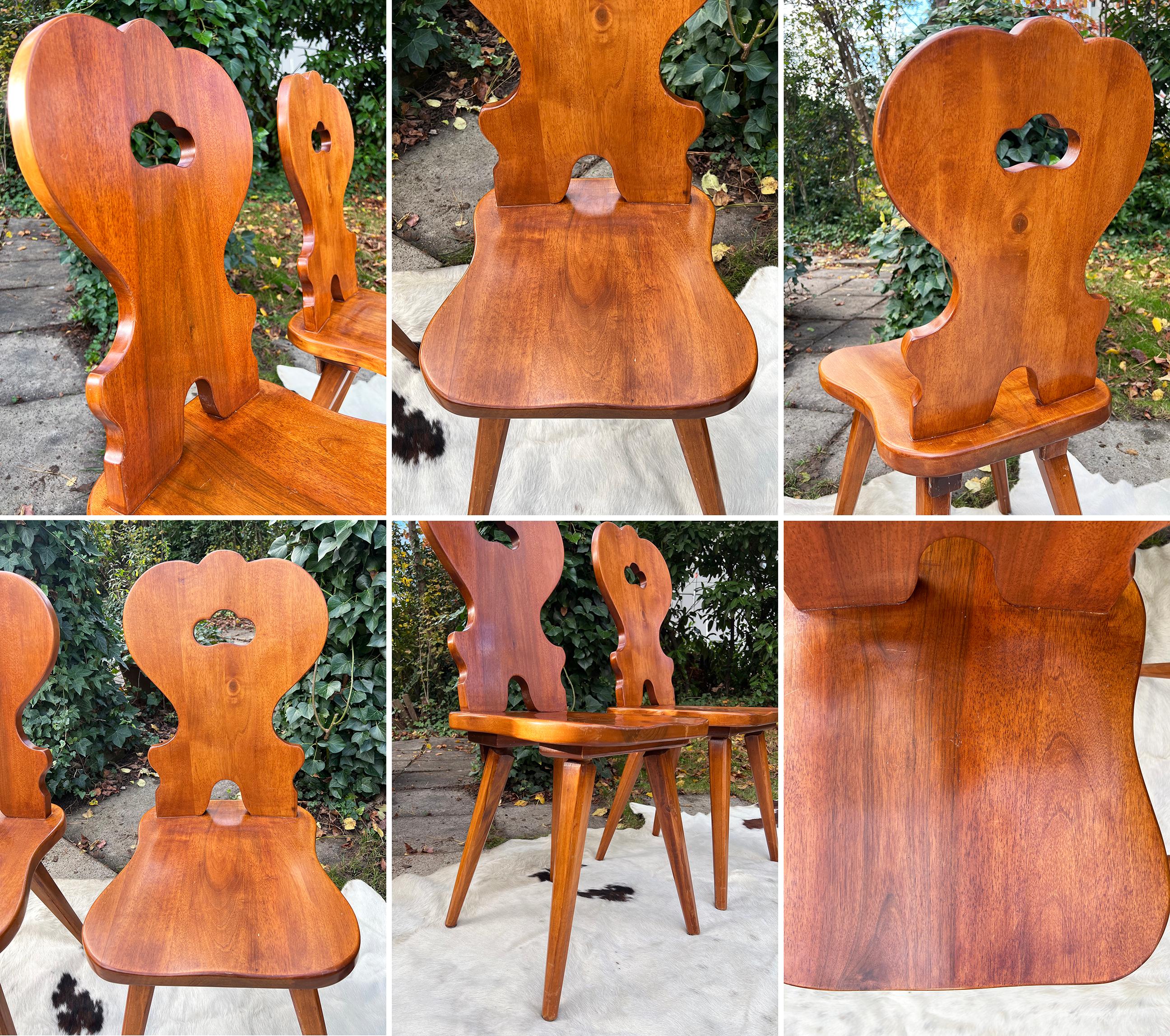 Absolutely stunning RARE complete set of 6 Swiss Solid wood farm house traditional dining chairs.

The chairs are handmade and display beautiful craftsmanship and detailing throughout. All of the chairs are in good overall vintage condition, with