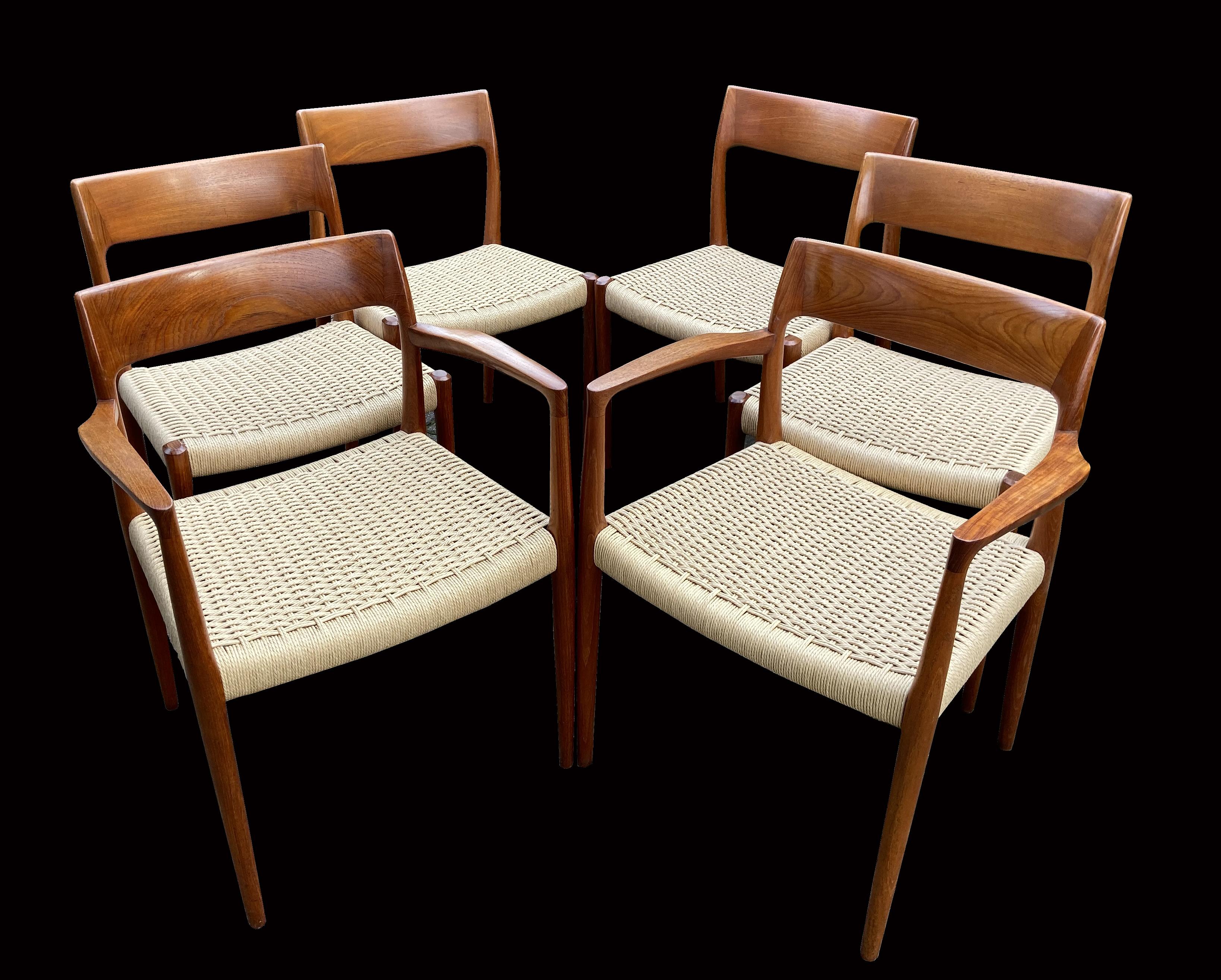 These are a fabulous and early original set of diners by the most famous dining chair designer Niels O. Moller, they are called model 77 ( The ones with no arms) and model 57 (the arm version).
They were designed circa 1950s and these were probably