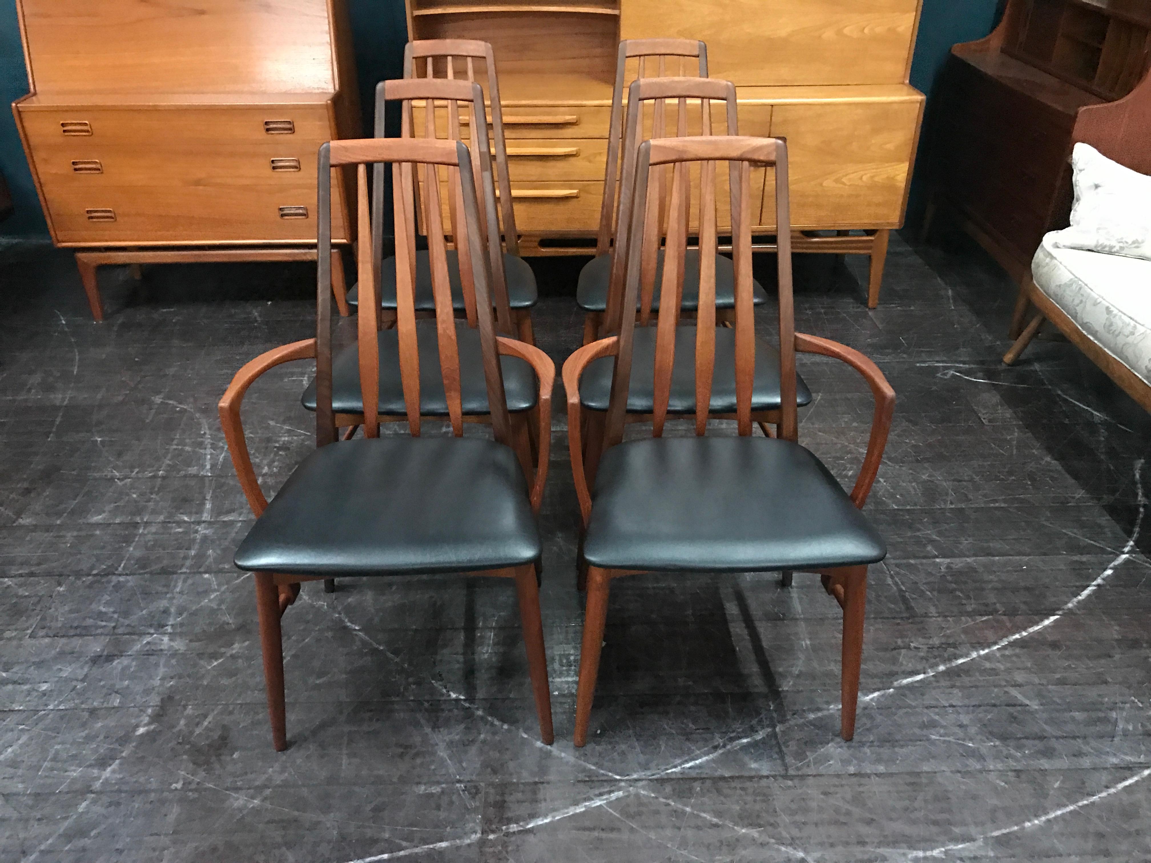 This is a set of very desirable midcentury dining chairs with black vinyl seat pads designed in Denmark in the 1960s by Niels Koefoed and manufactured by Koefoeds Hornslet. These beautiful high back chairs are truly elegant in their design and