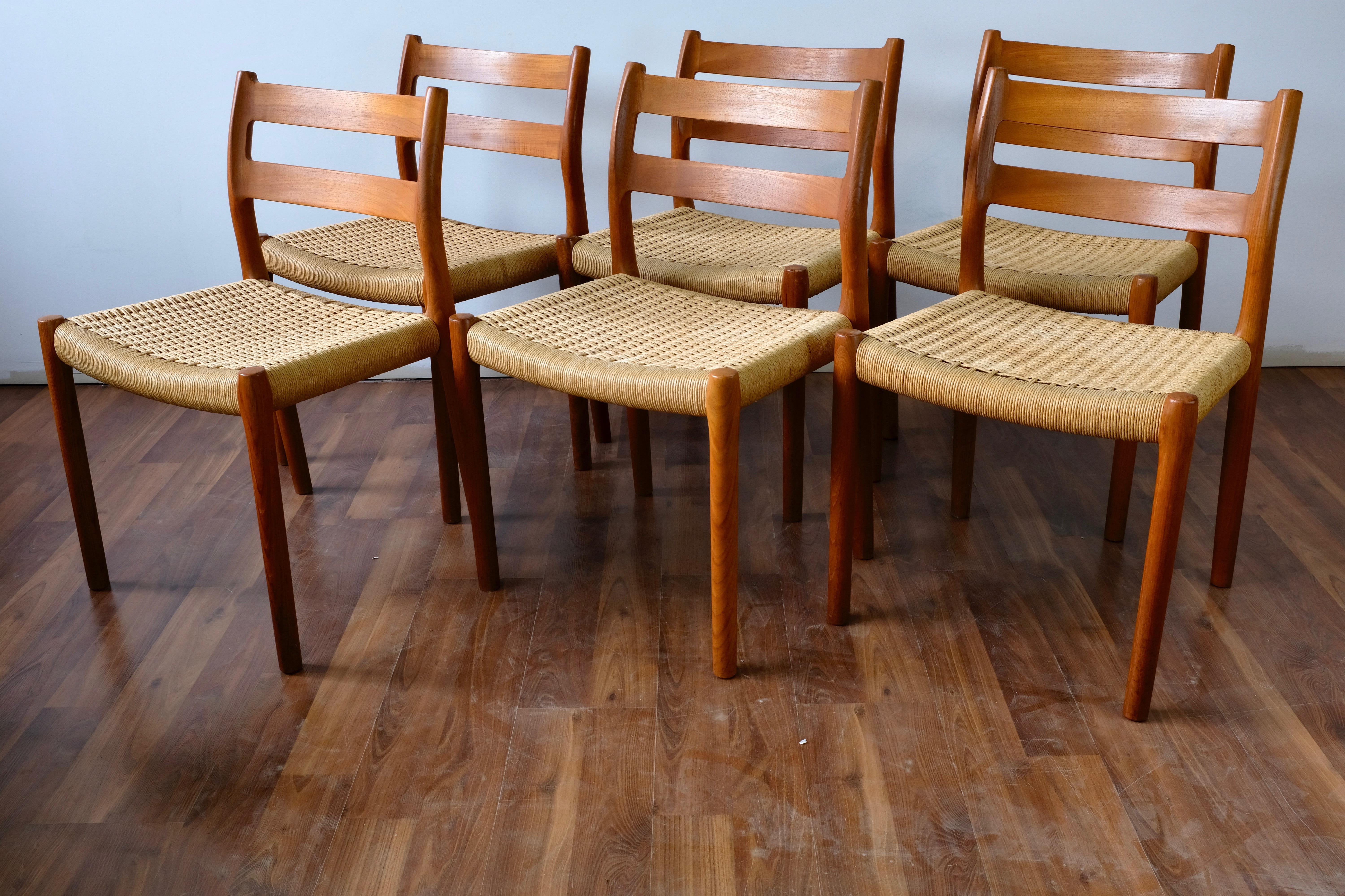 Set of 6 dining chairs designed by Niels Otto Møller and made in Denmark by J.L. Møllers Møbelfabrik.

The chairs have solid teak frames and papercord seats. They are in very good condition but show some wear at the bottoms of the legs and on the