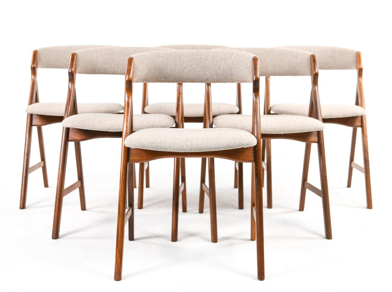A set of (6) Danish mid-century dining chairs in beige wool upholstery with 