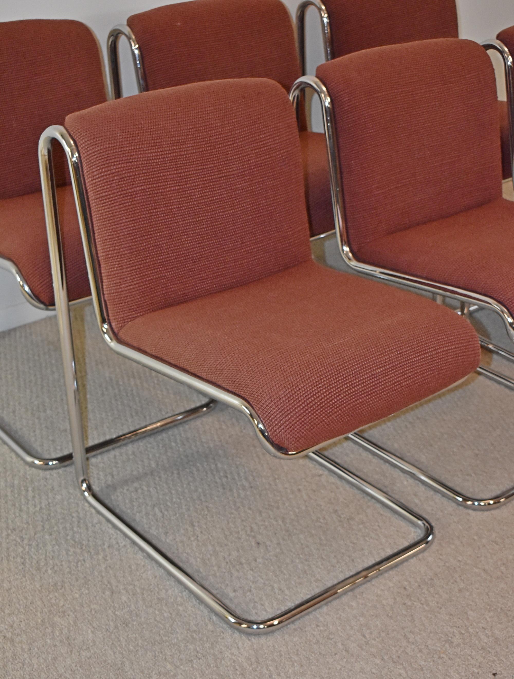 Set of 6 thonet chrome upholstered dining chairs. 1970s Reverse catilevered tubular chrome frame Bahaus design. Heavy wool upholstering in good condition. No rust or chrome damage. Label is on the chairs. Dimensions: 32
