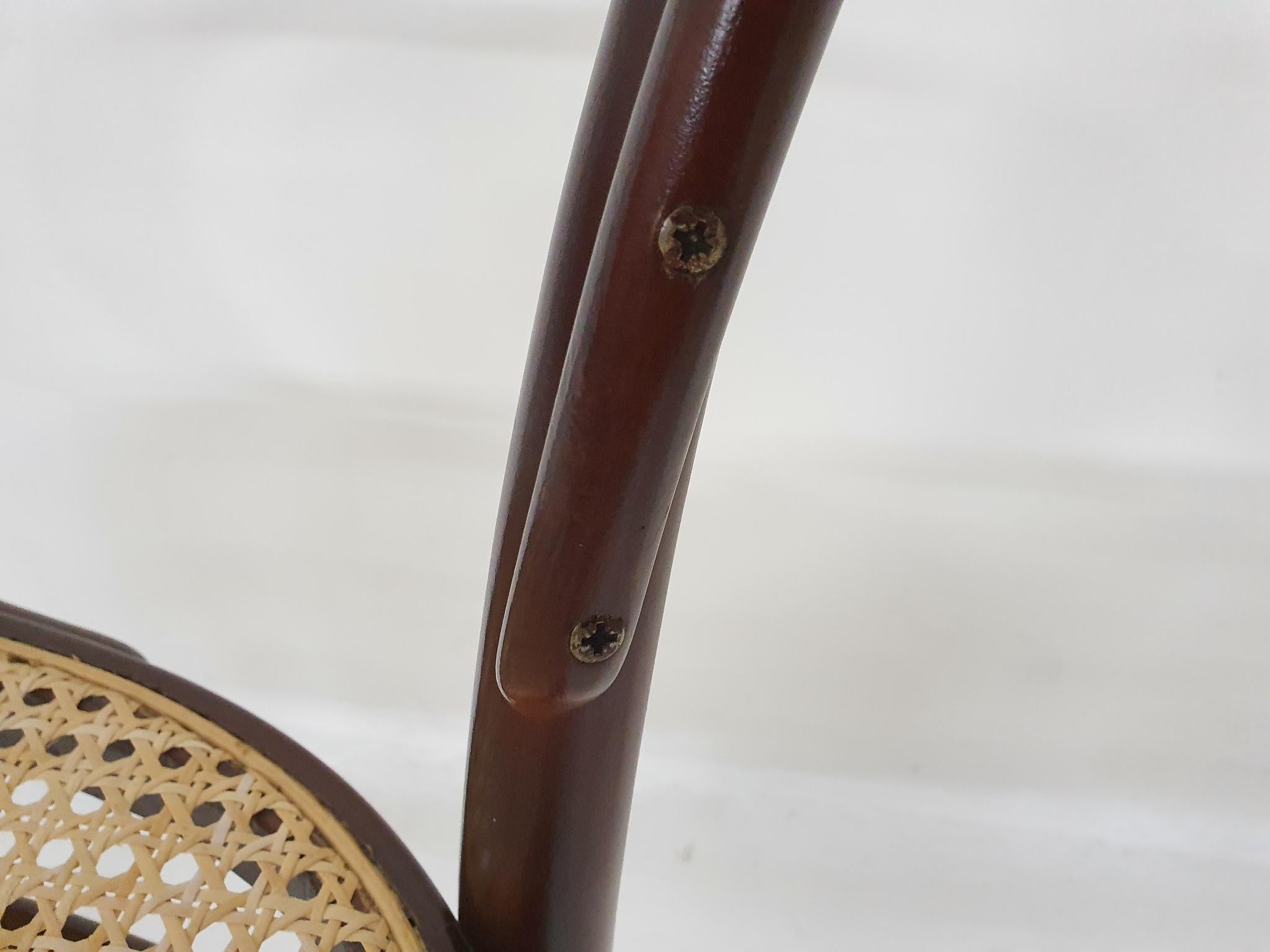 Dark brown beech wood  dining chairs with webbing seats. 
Four with arm rests and 2 without arm rests. In good condition.