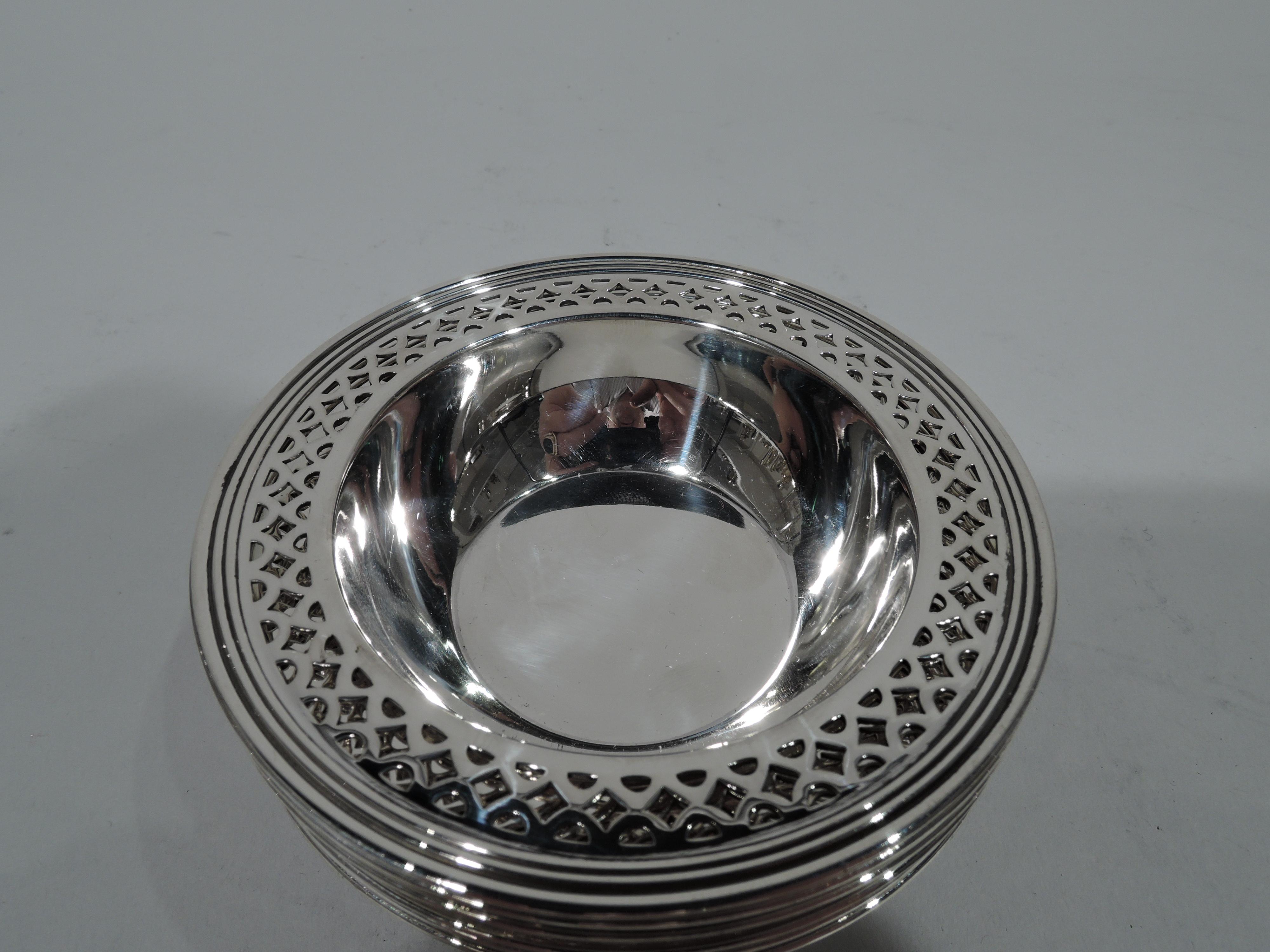 Set of 6 Art Deco sterling silver nut dishes. Made by Tiffany & Co. in New York, circa 1922. Each: Solid and tapering well and flat rim with geometric piercing and reeding. Hallmark includes pattern no. 20096K (first produced in 1922) and director’s