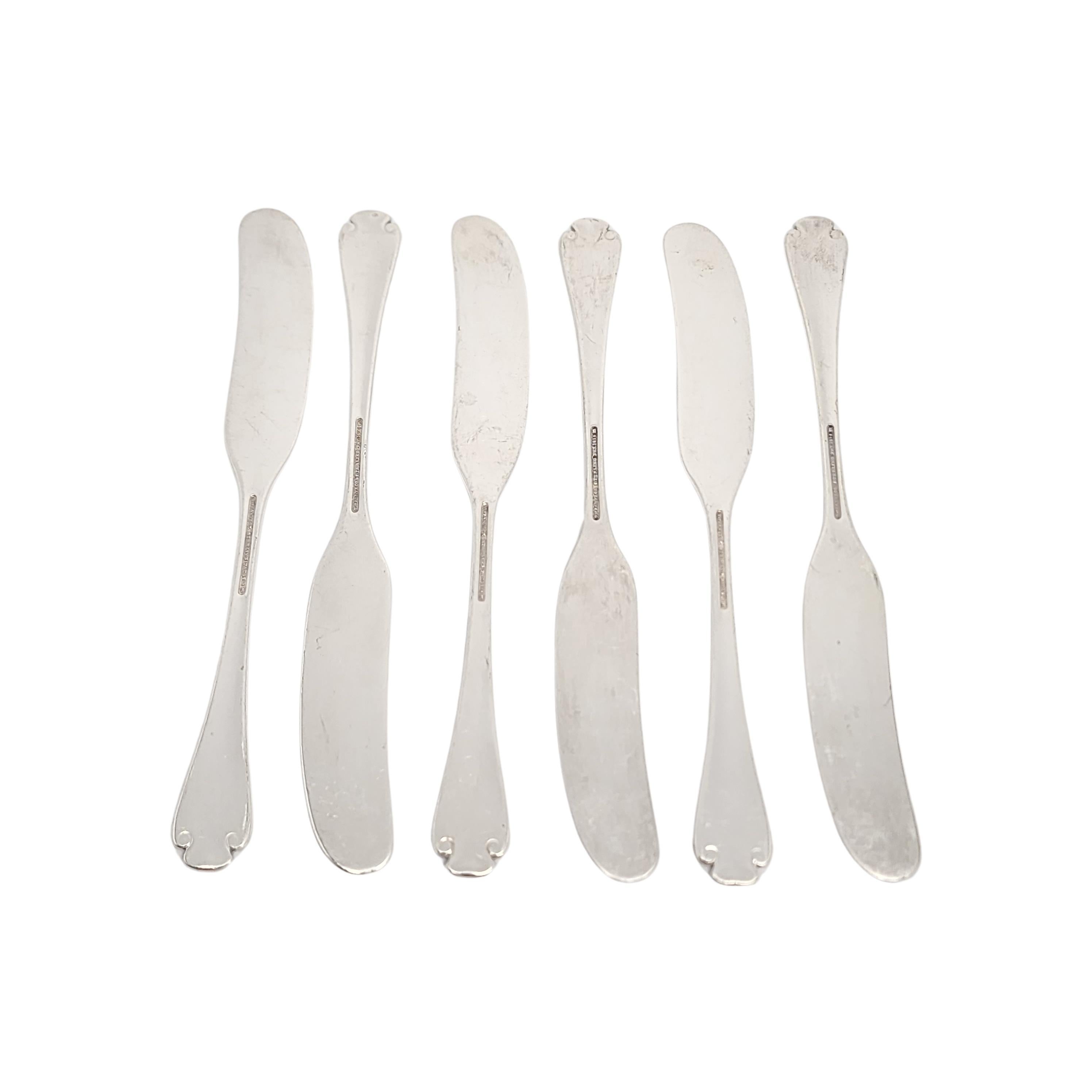 Set of 6 sterling silver flat handle butter spreaders by Tiffany & Co in the Flemish pattern.

No monogram.

The Flemish pattern features a simple and elegant scroll design, making it a timeless classic that is still in demand today. Hallmarks date