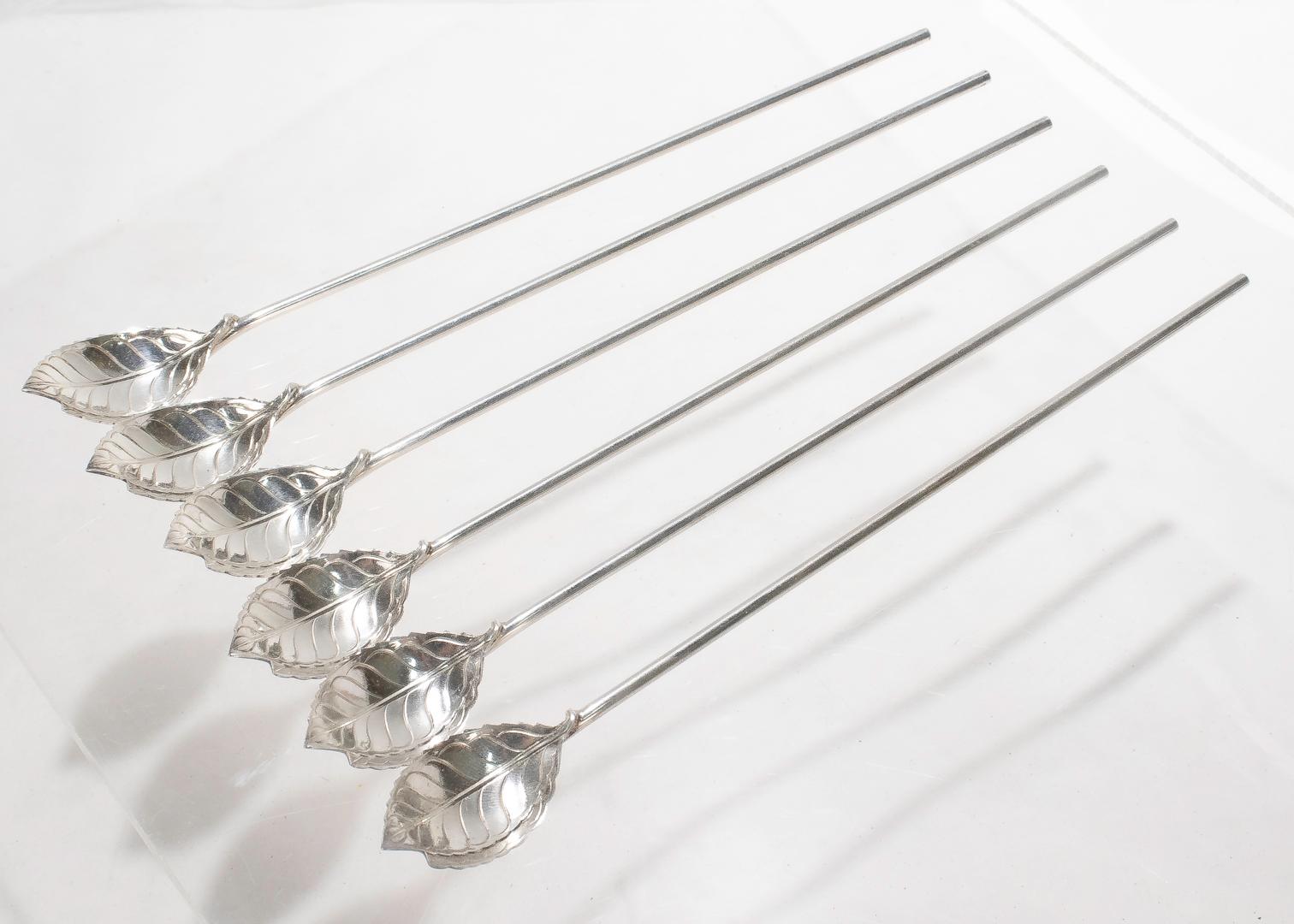 A fine set of 6 mint julep spoons (or ice tea straws).

In sterling silver.

By Tiffany & Co. 

With figural leaf form spoon bowls mounted on long narrow straw handle.

Simply great style for your favorite Summer drink!

Date:
Mid-20th
